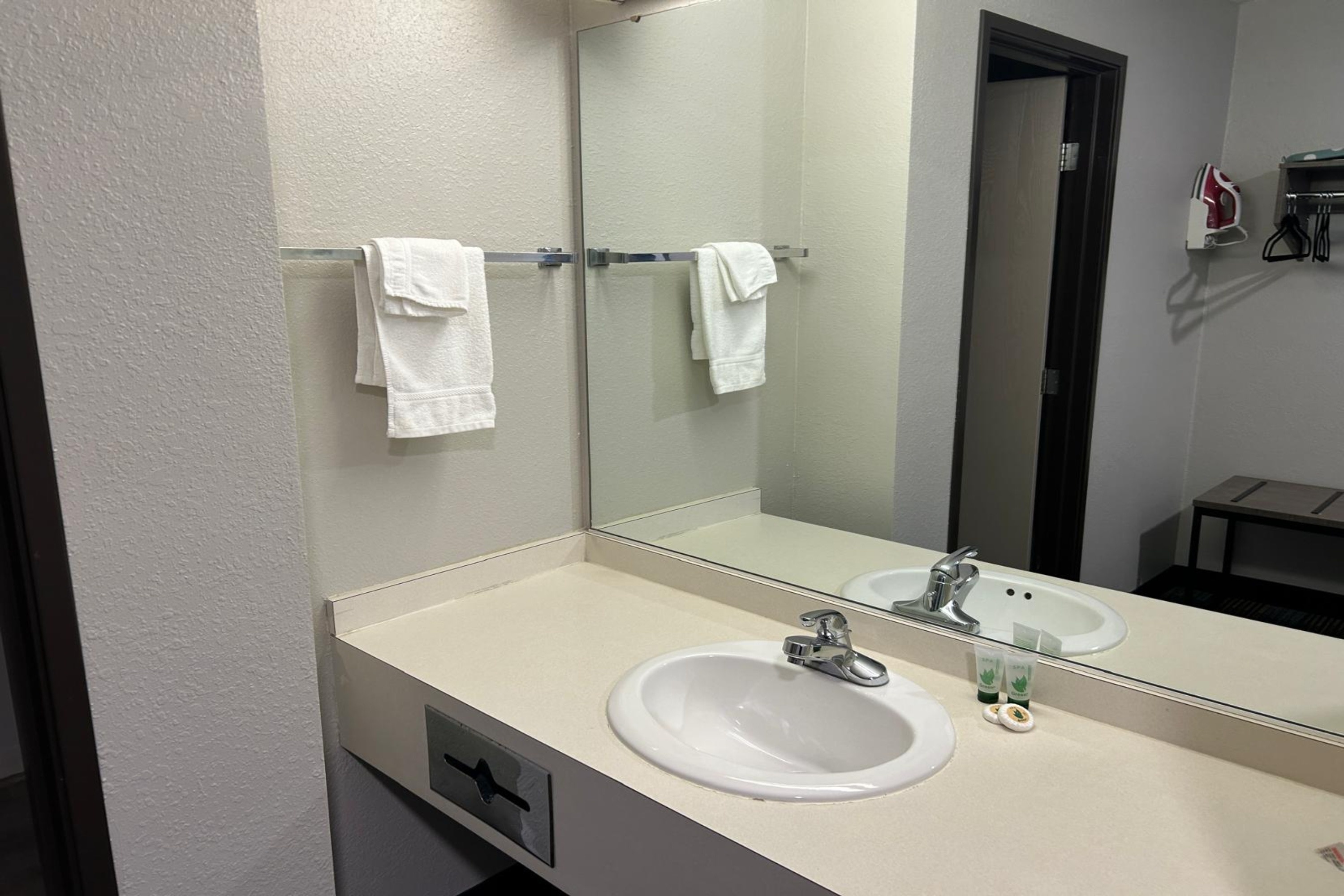 Guest room bath at the AmericInn by Wyndham Saint Ignace in Saint Ignace, Michigan