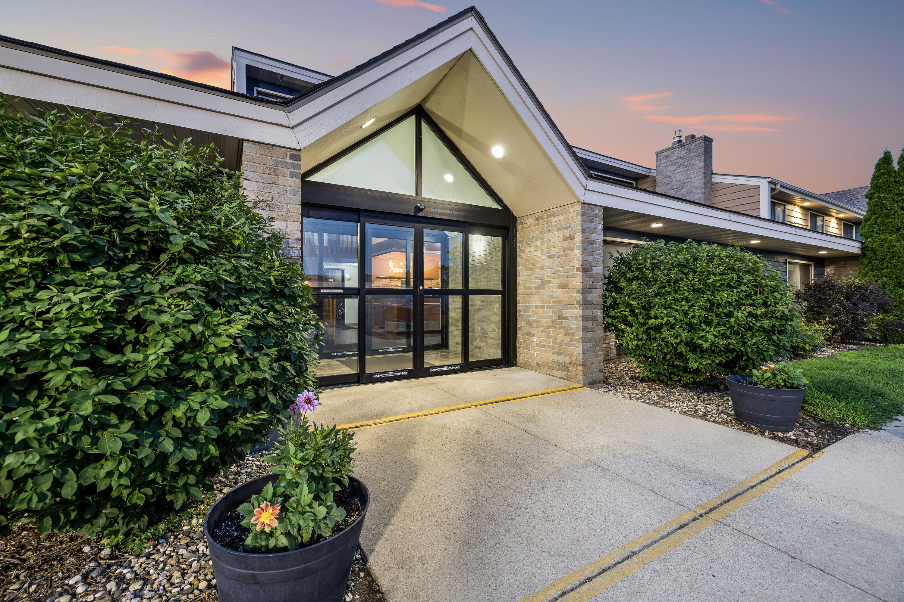 Exterior Dusk Image of AmericInn by Wyndham Albert Lea hotel in Albert Lea, Minnesota