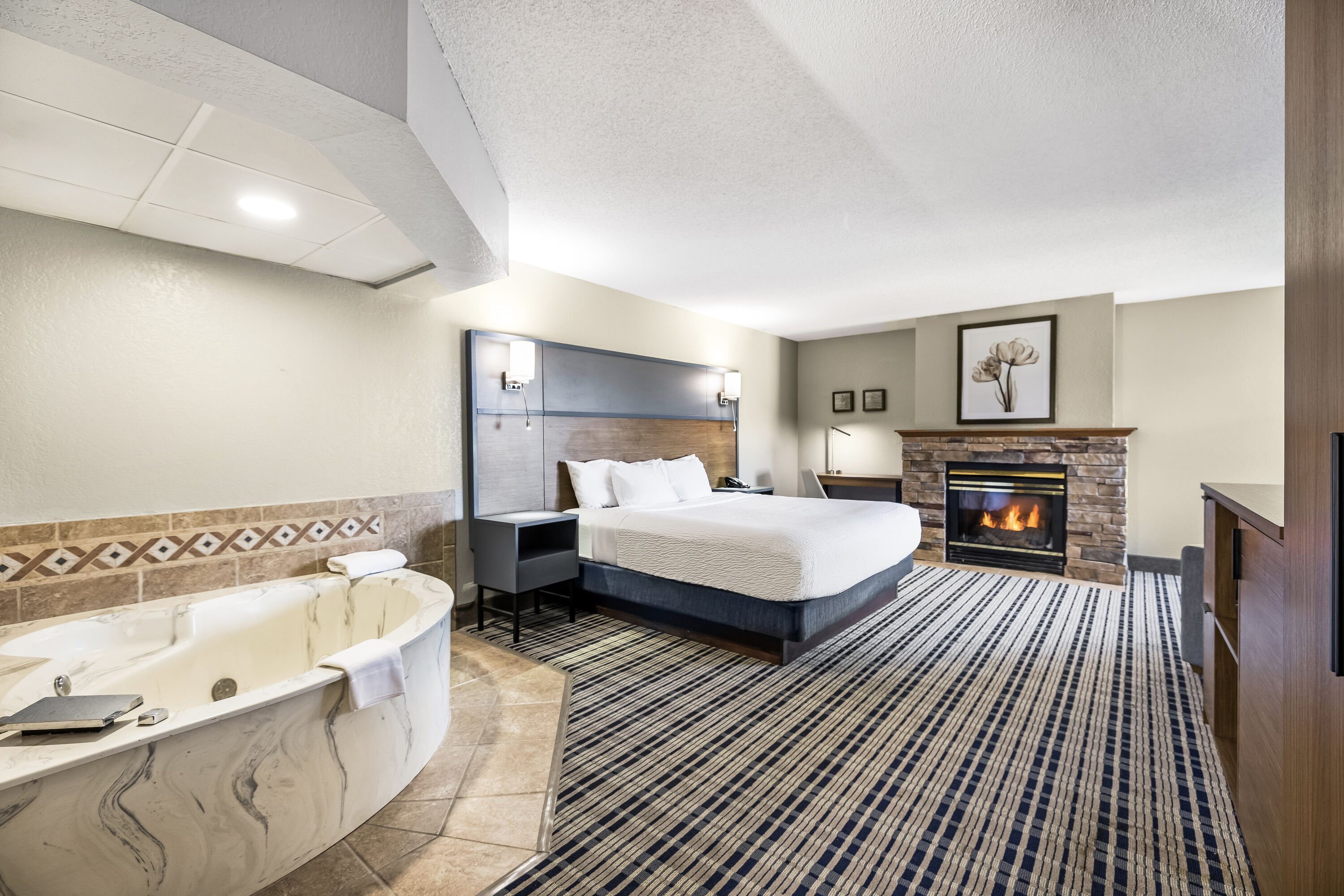 King bed guest room at the AmericInn by Wyndham Albert Lea in Albert Lea, Minnesota
