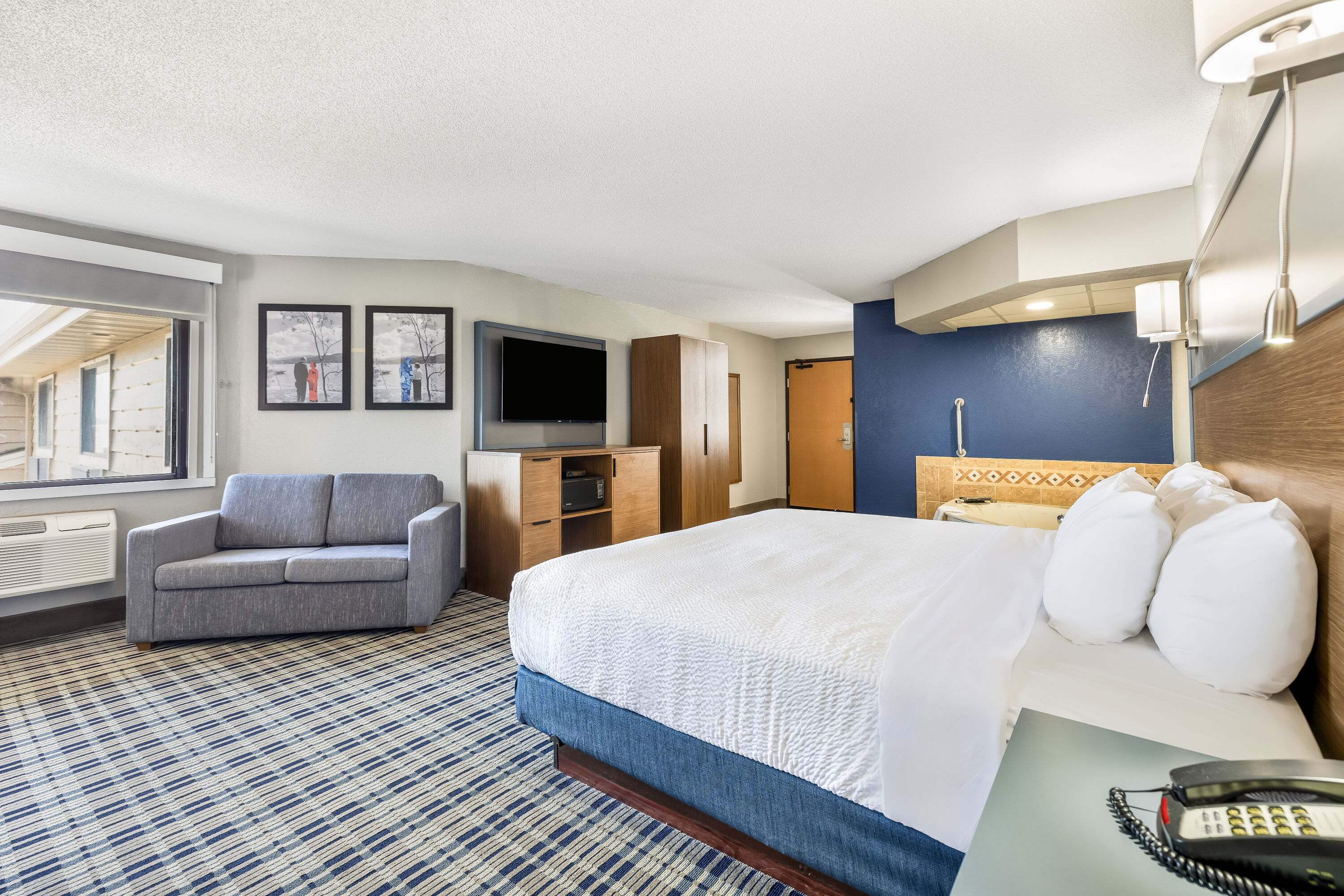 King bed guest room at the AmericInn by Wyndham Albert Lea in Albert Lea, Minnesota