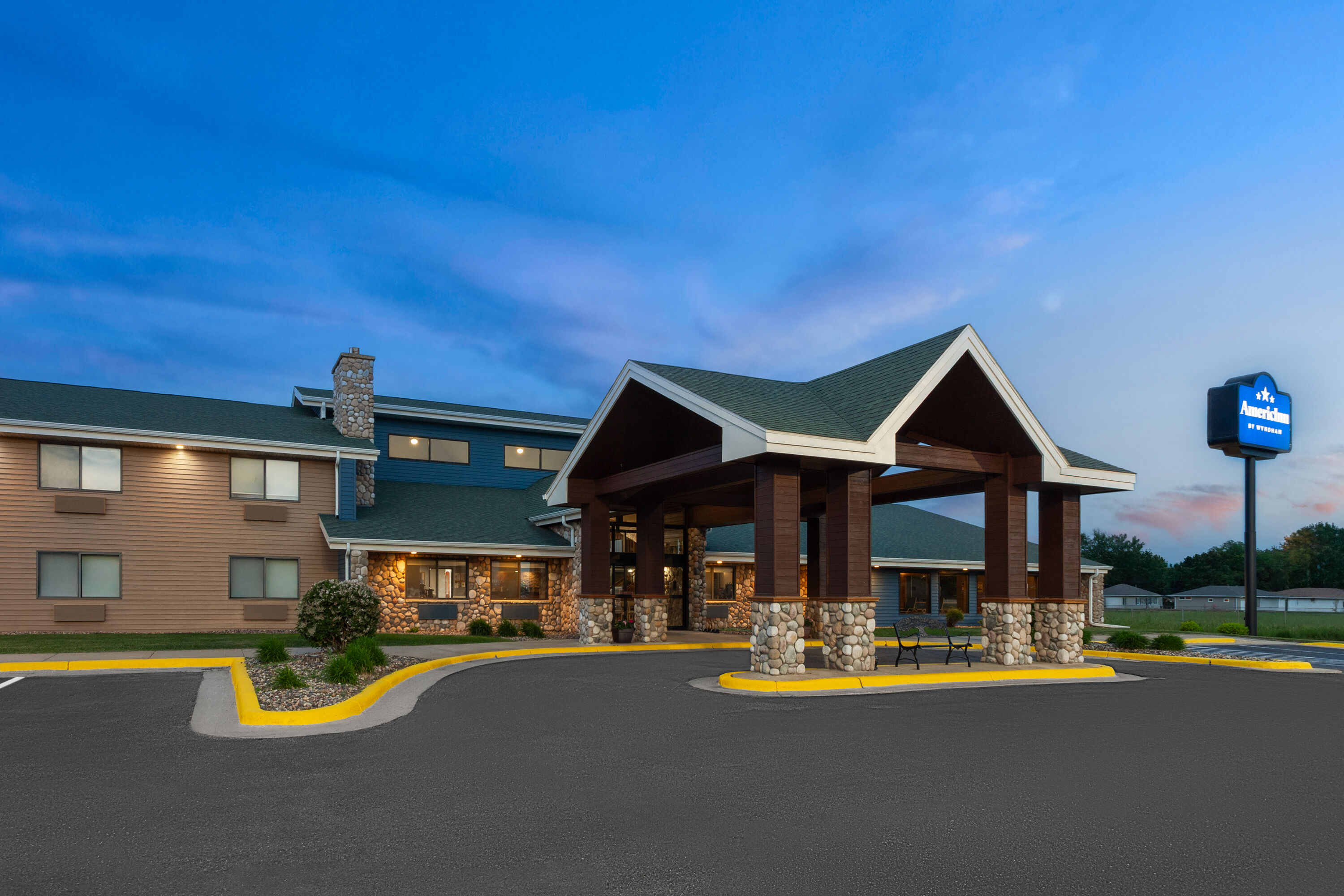Exterior Dusk Image of AmericInn by Wyndham Austin hotel in Austin, Minnesota