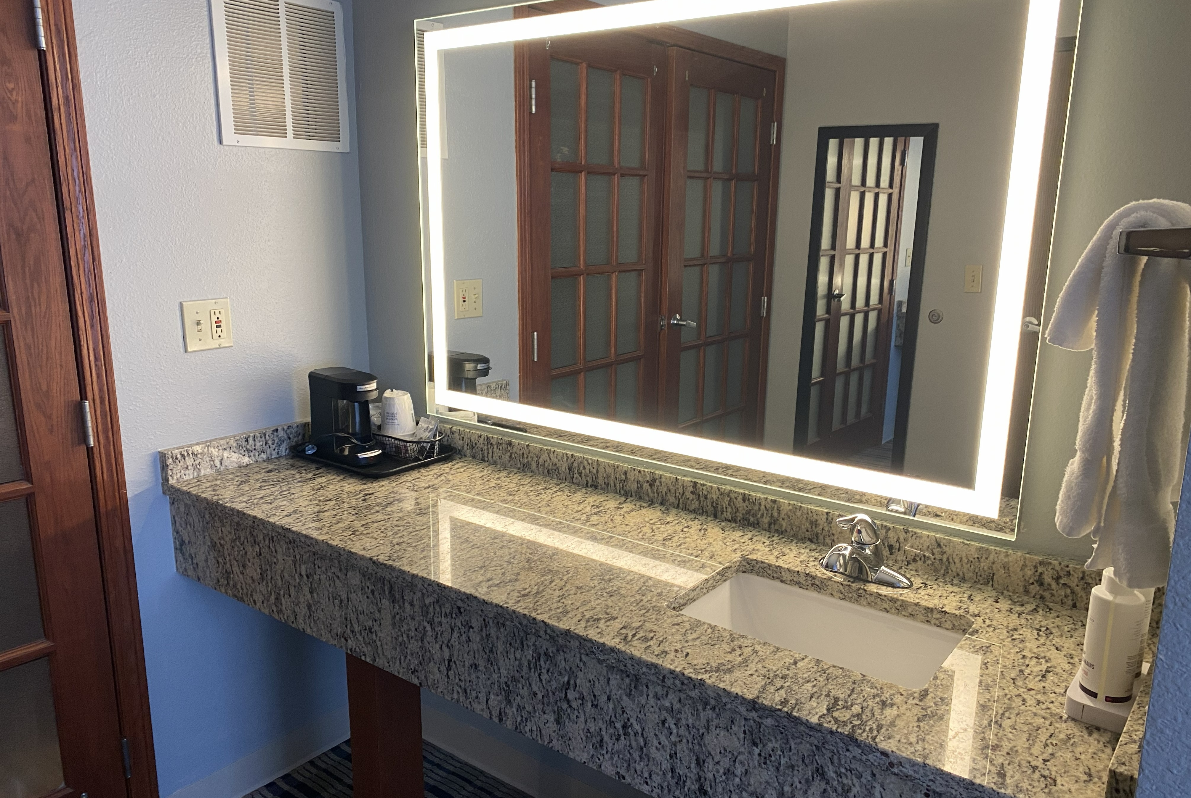 Guest room bath at the AmericInn by Wyndham Austin in Austin, Minnesota