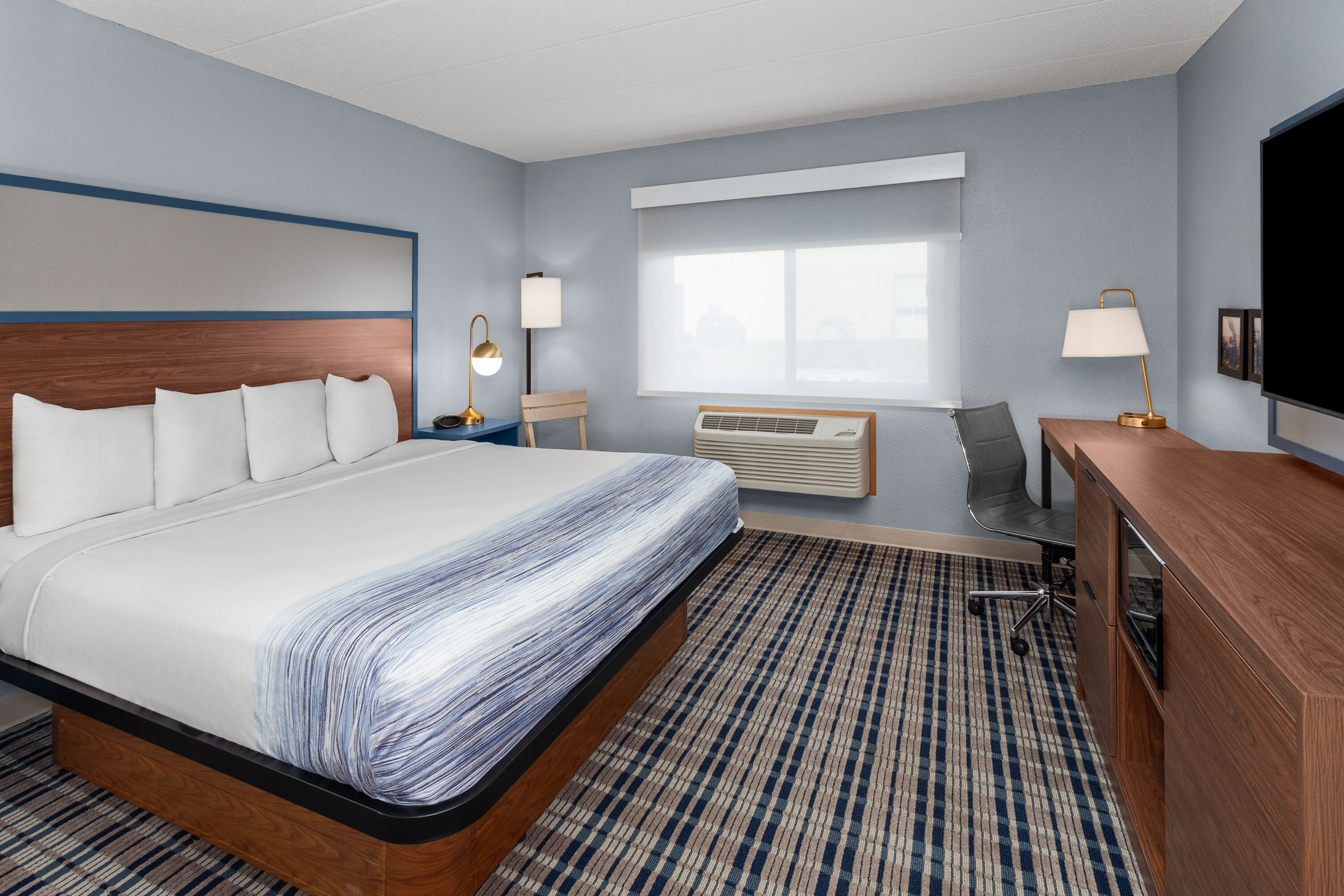 Guest room at the AmericInn by Wyndham Austin in Austin, Minnesota