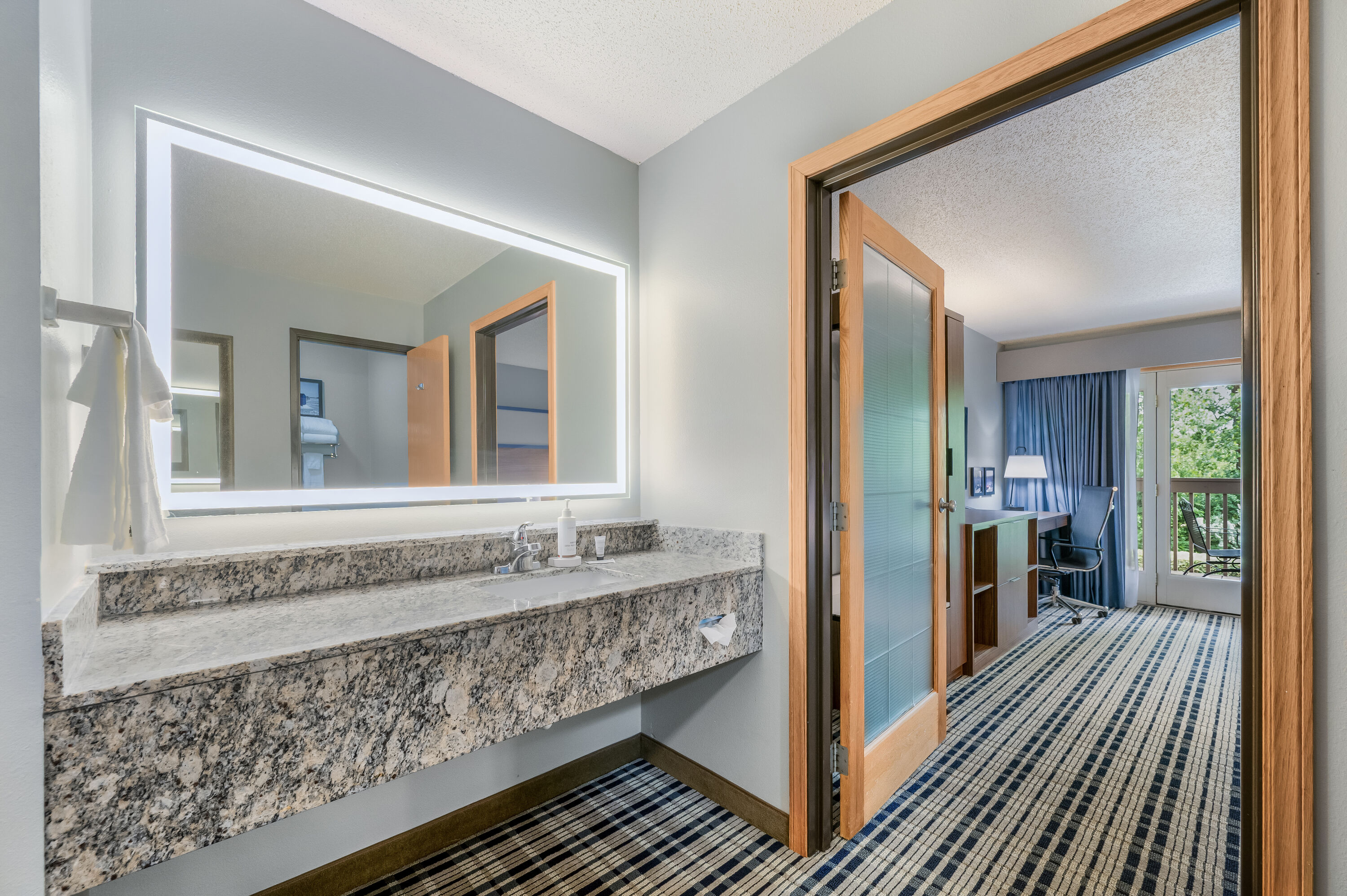 Guest room bath at the AmericInn by Wyndham, Baudette in Baudette, Minnesota