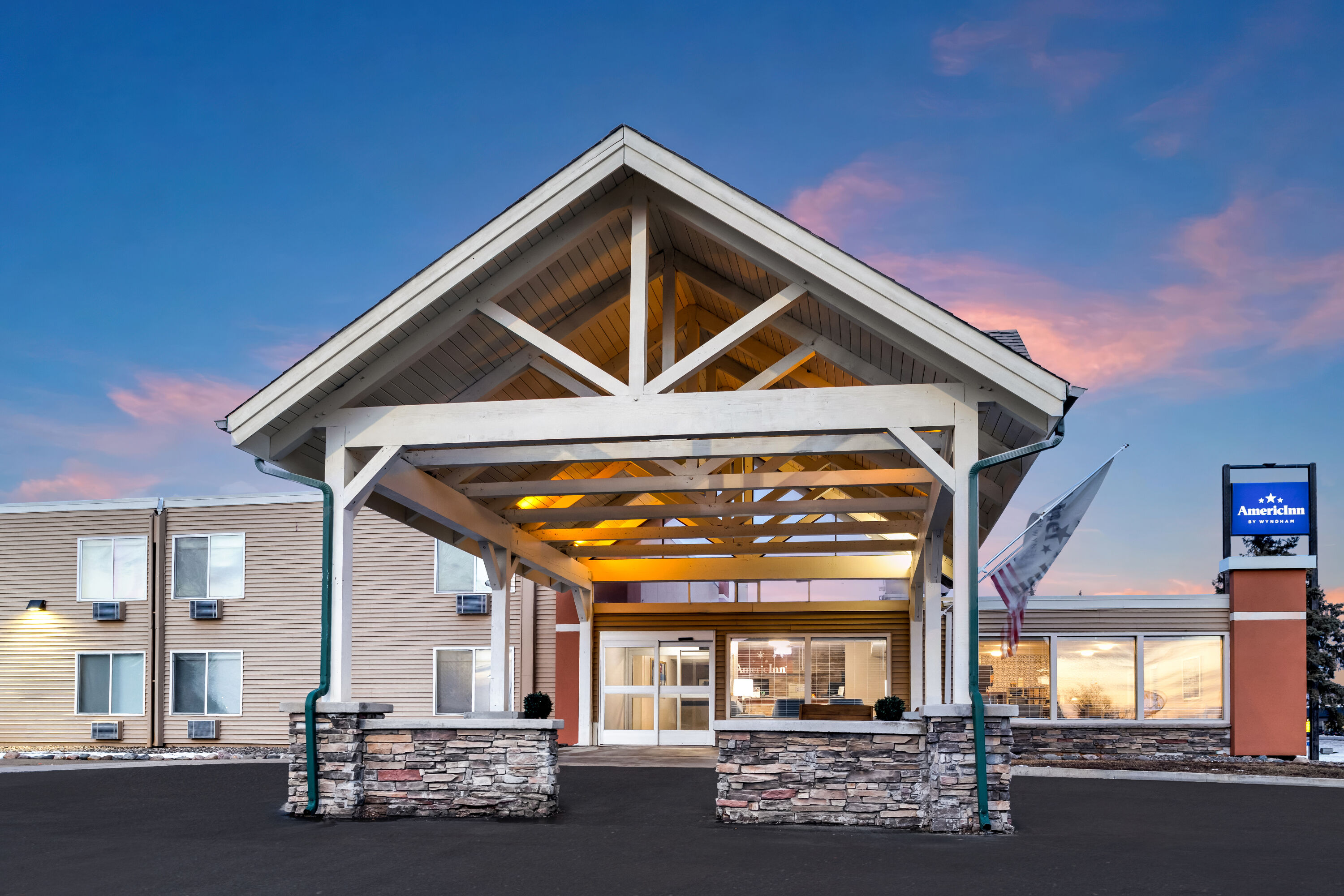 Exterior Dusk Image of AmericInn by Wyndham Baxter Brainerd hotel in Baxter, Minnesota