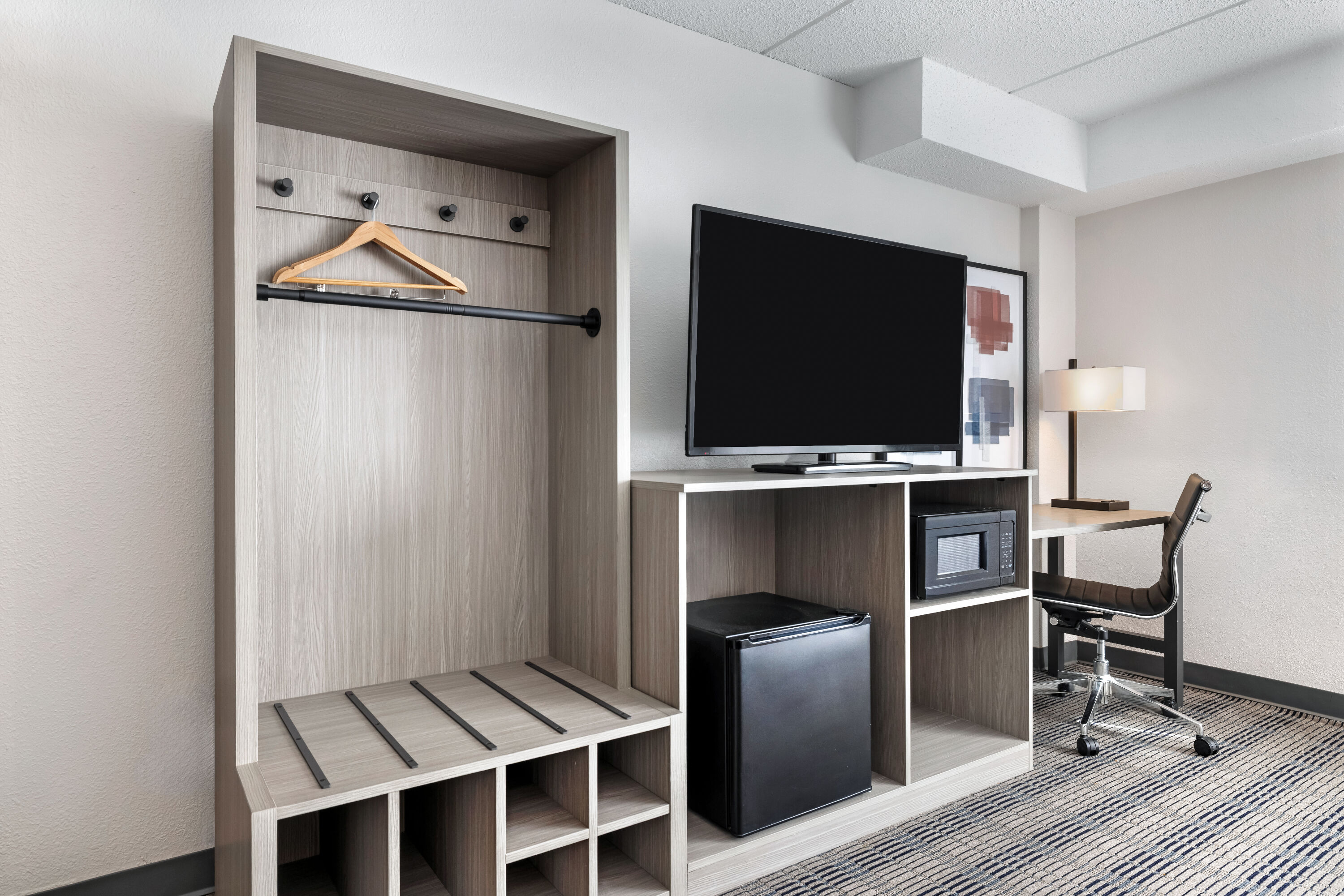 King bed guest room at the AmericInn by Wyndham Baxter Brainerd in Baxter, Minnesota