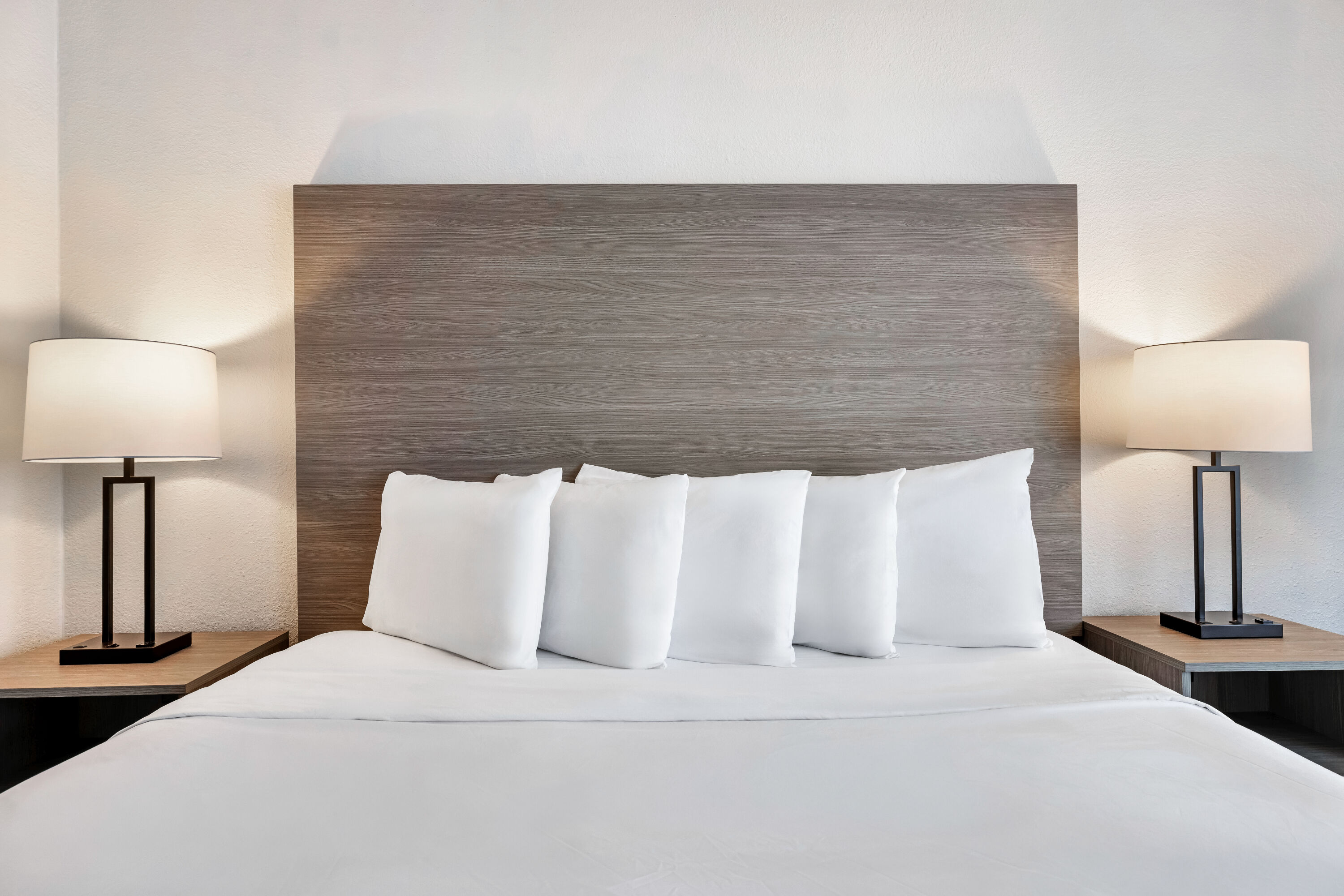 King bed guest room at the AmericInn by Wyndham Baxter Brainerd in Baxter, Minnesota