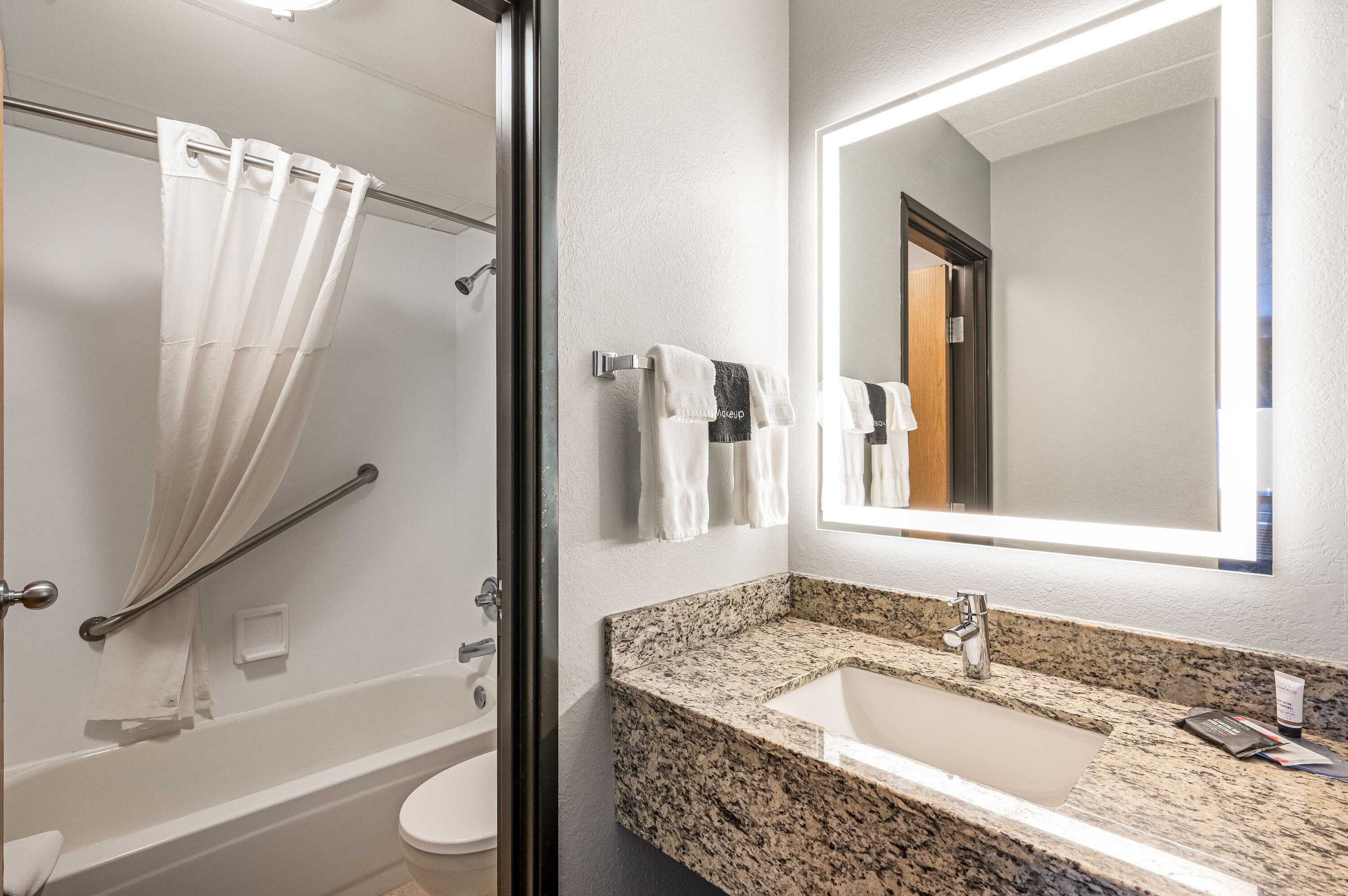 Guest room bath at the AmericInn by Wyndham Bemidji in Bemidji, Minnesota