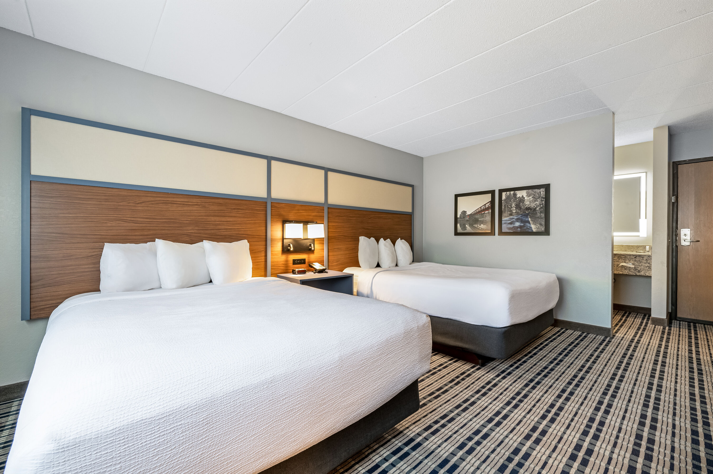 Queen bed guest room at the AmericInn by Wyndham Bemidji in Bemidji, Minnesota