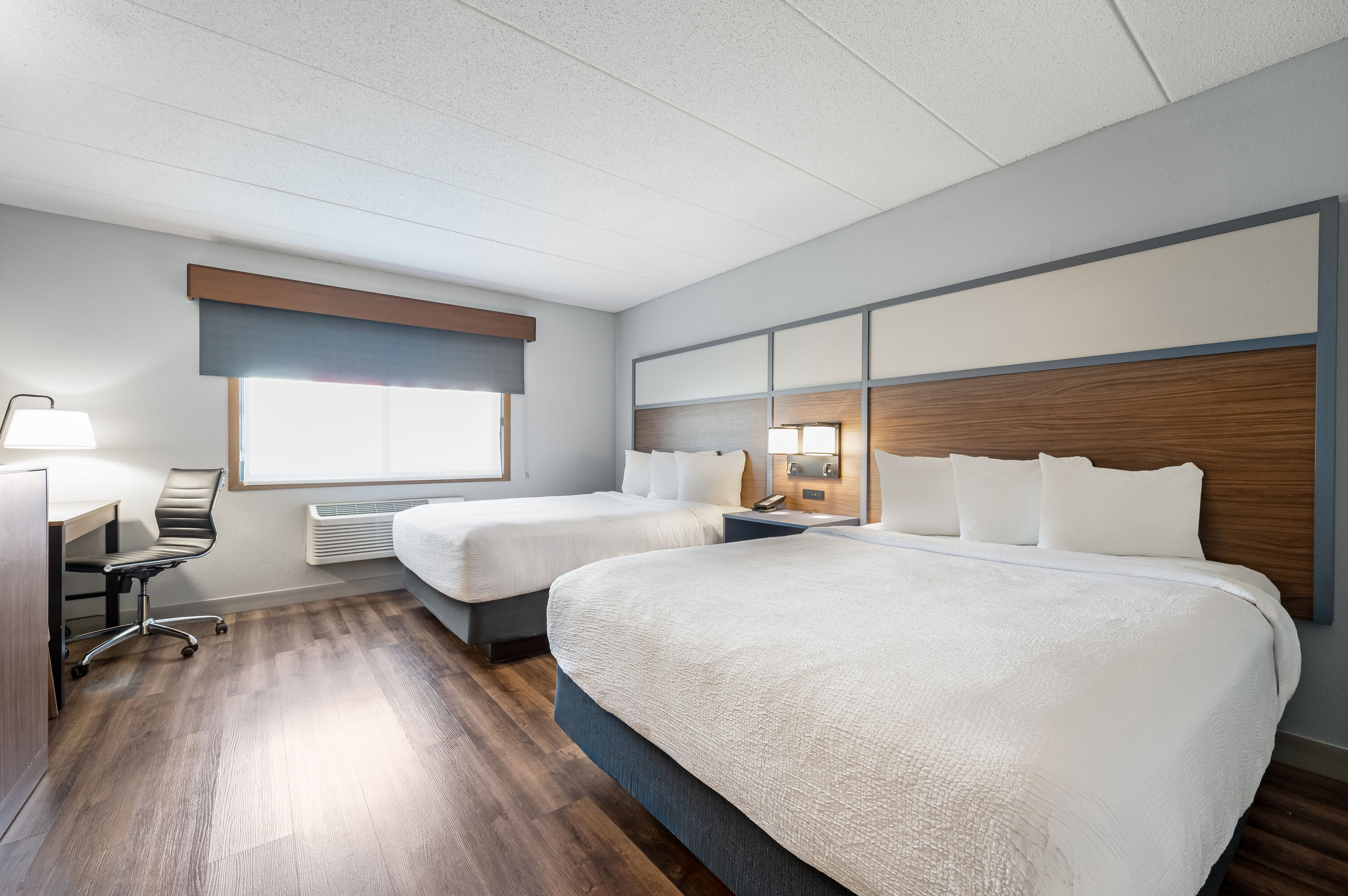 Queen bed guest room at the AmericInn by Wyndham Bemidji in Bemidji, Minnesota