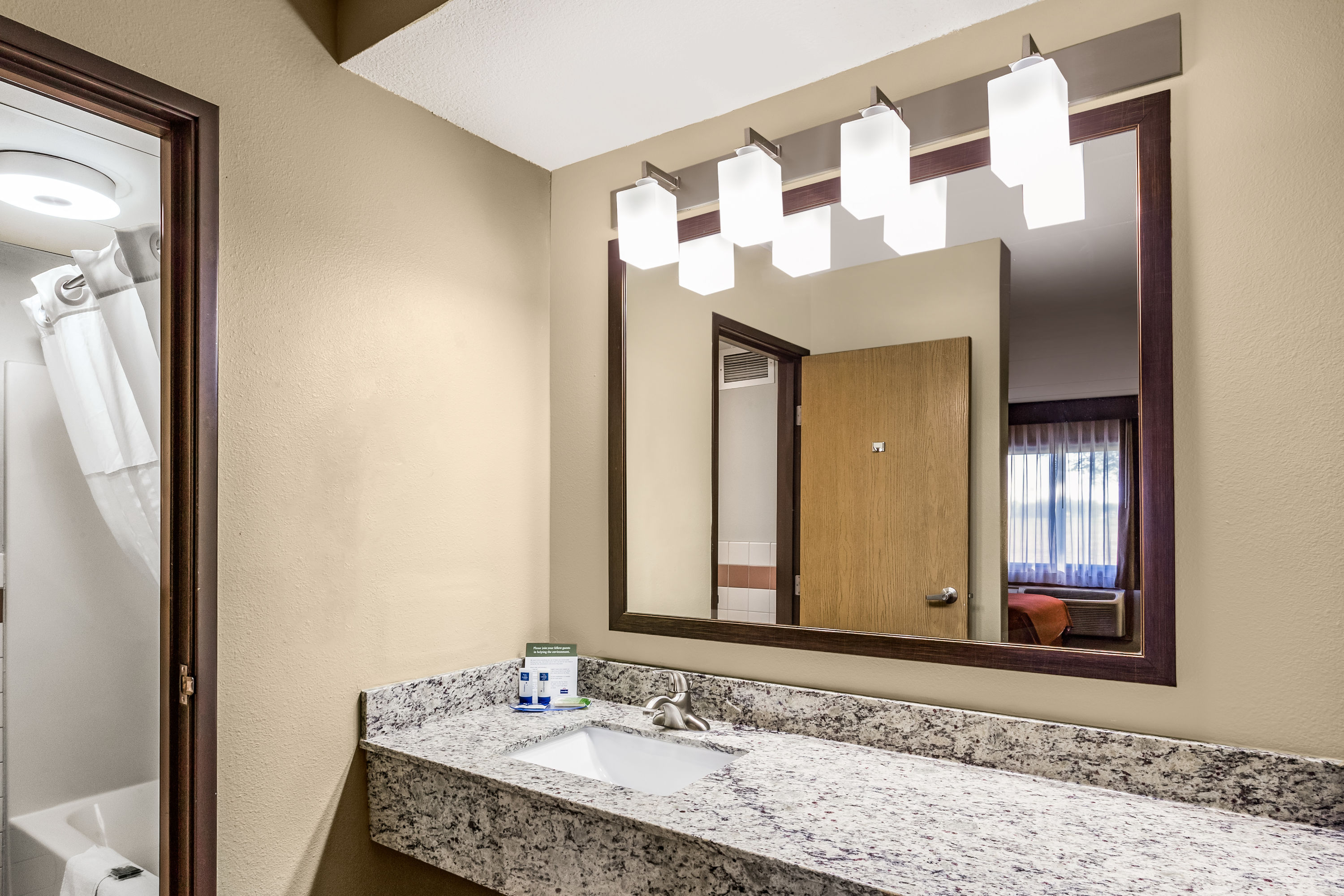 Guest room bath at the AmericInn by Wyndham Blue Earth in Blue Earth, Minnesota
