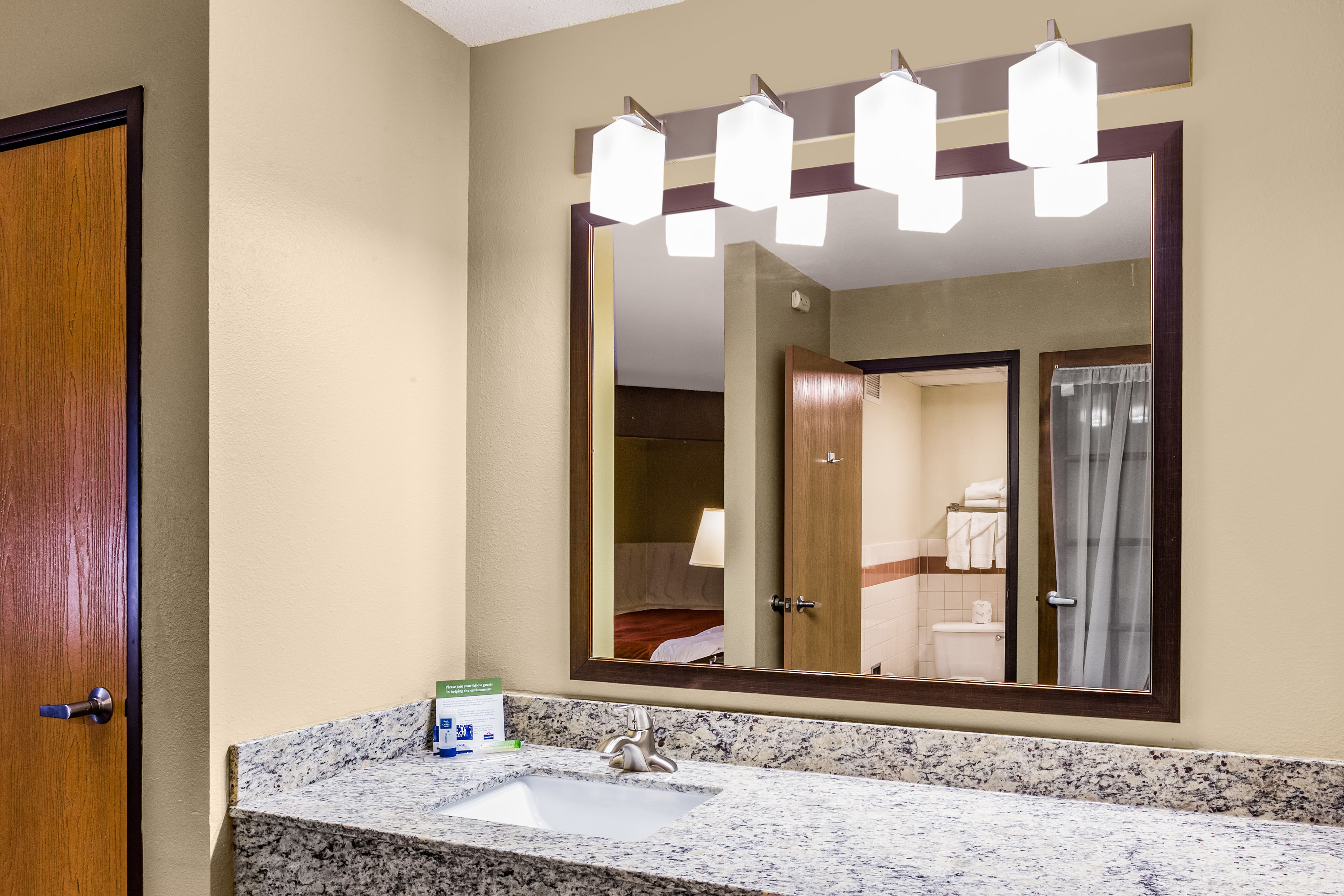 Guest room bath at the AmericInn by Wyndham Blue Earth in Blue Earth, Minnesota