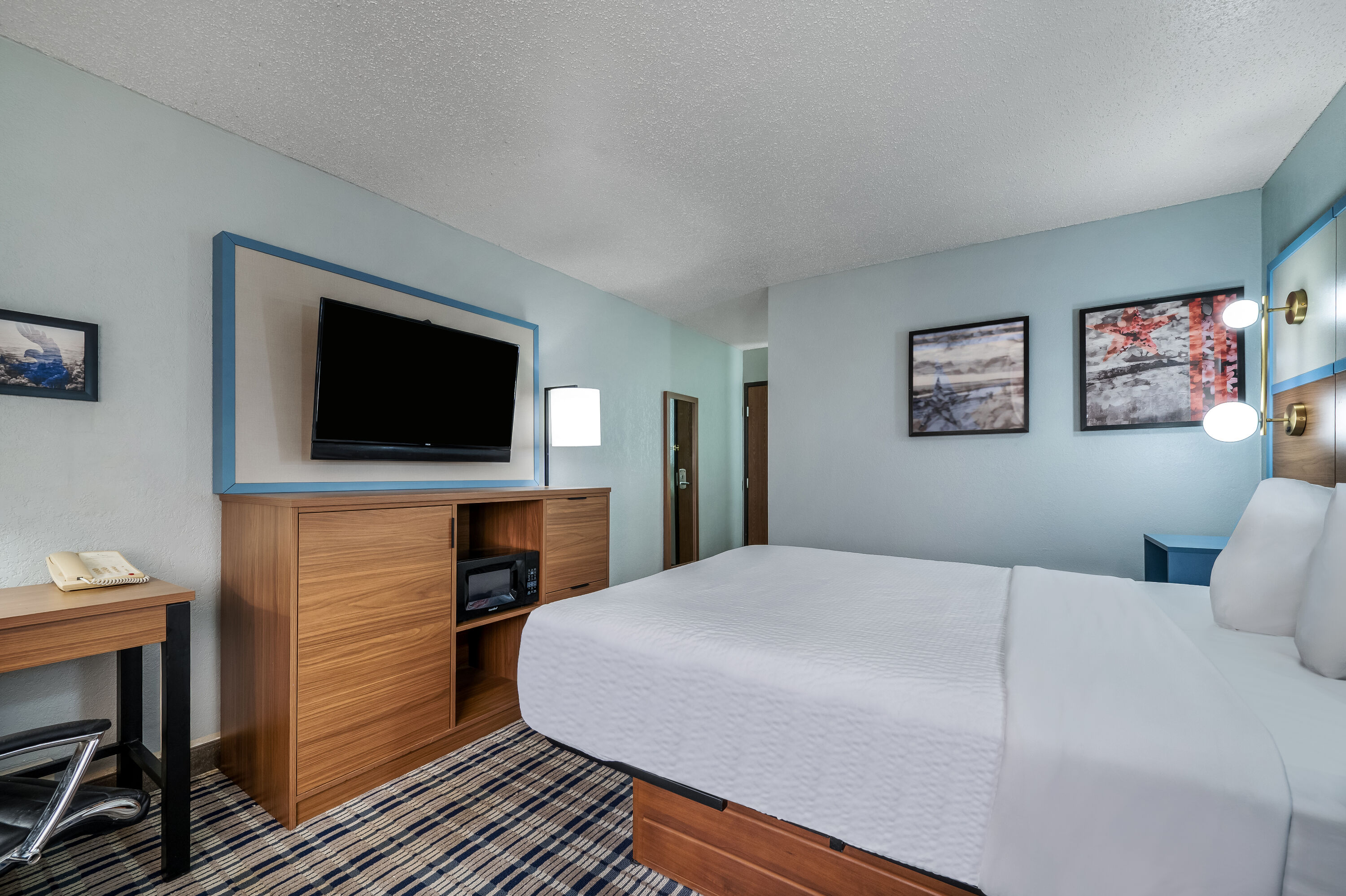 King bed guest room at the AmericInn by Wyndham Cloquet in Cloquet, Minnesota
