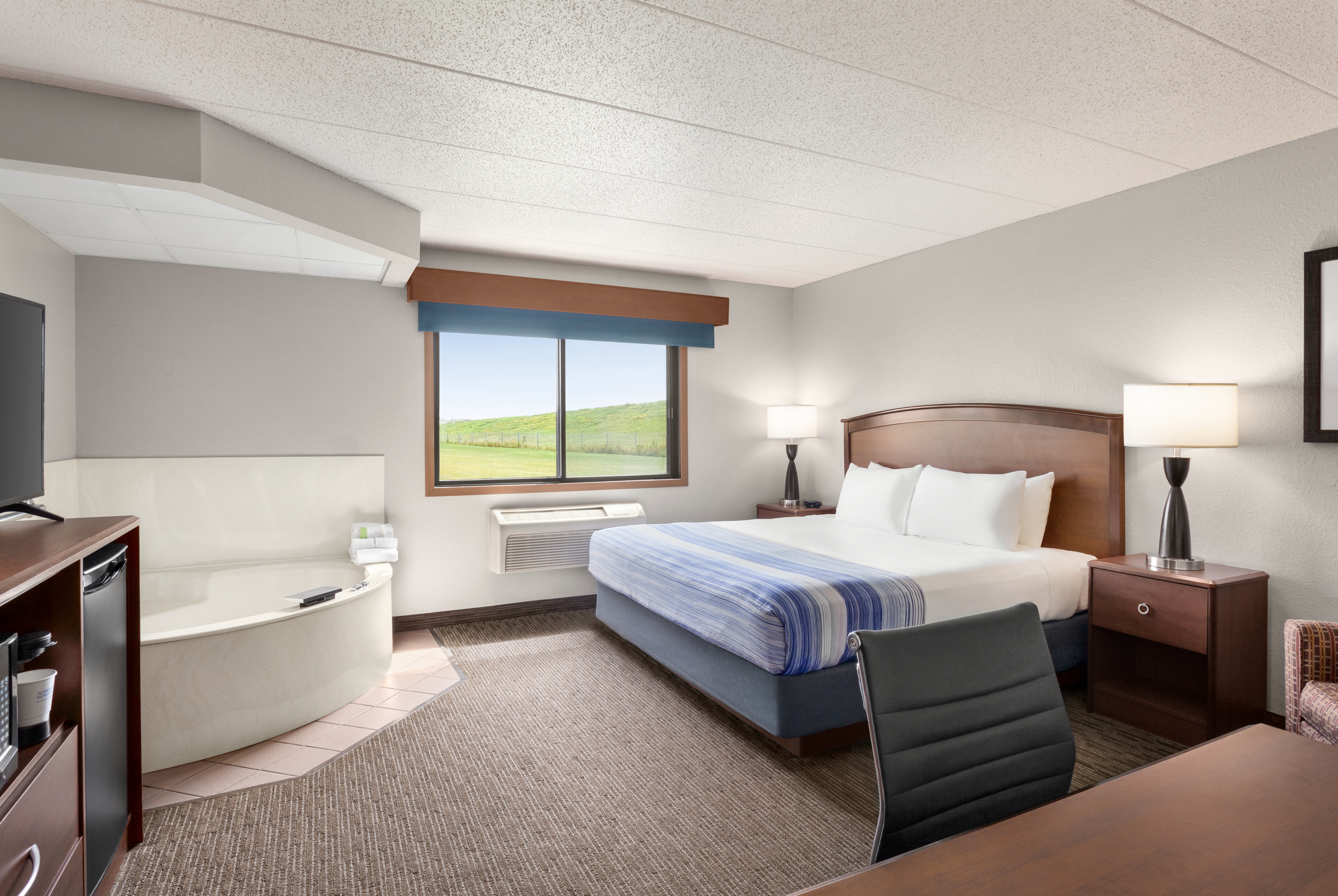 Guest room at the AmericInn by Wyndham Fergus Falls Conference Center in Fergus Falls, Minnesota