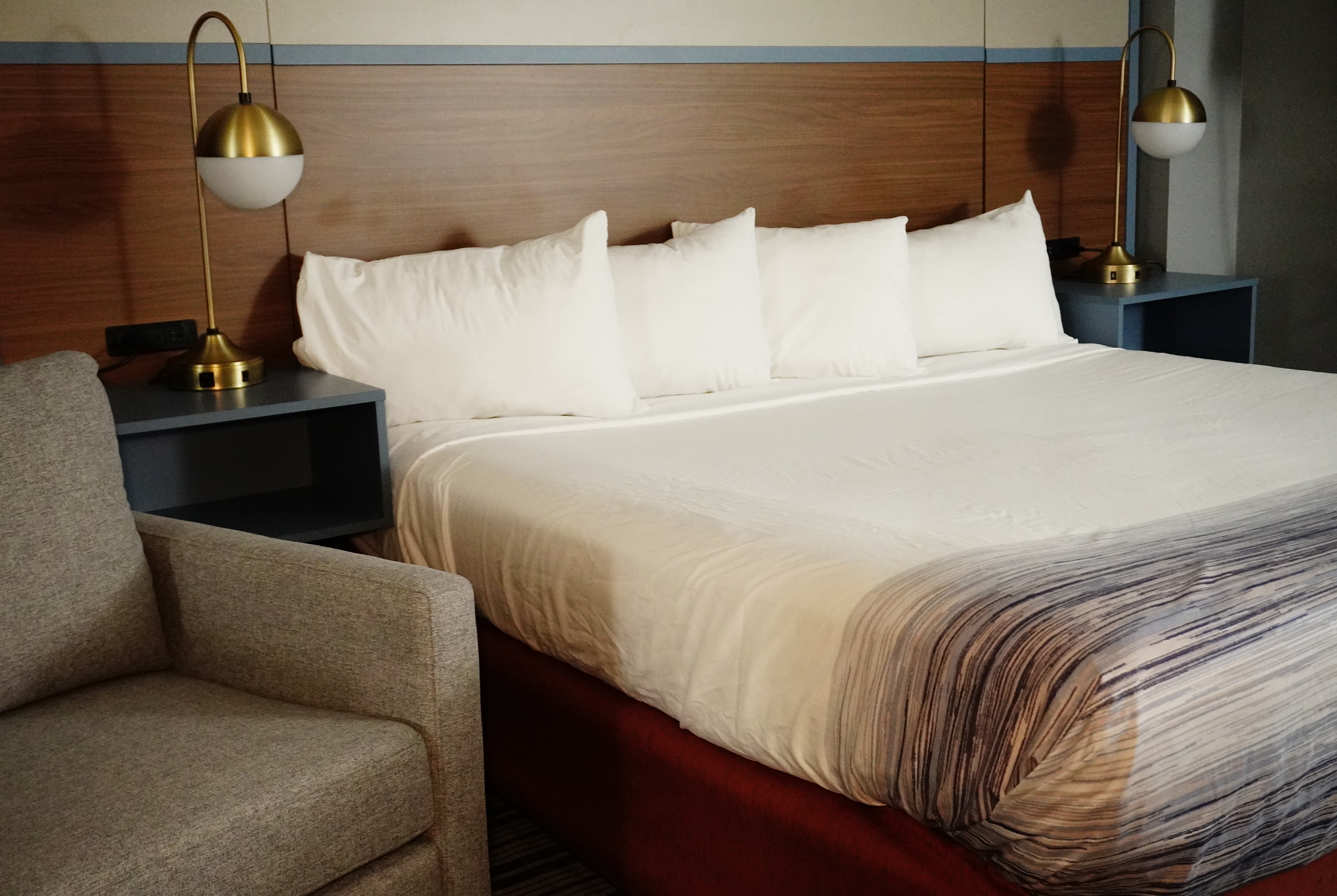 King bed guest room at the AmericInn by Wyndham Forest Lake in Forest Lake, Minnesota