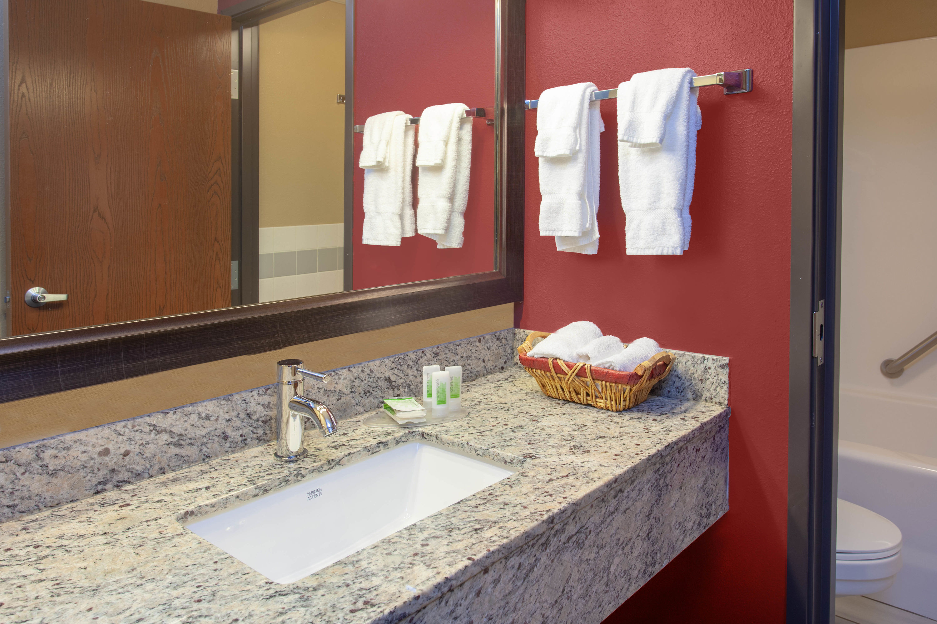 Guest room bath at the AmericInn by Wyndham Hutchinson in Hutchinson, Minnesota