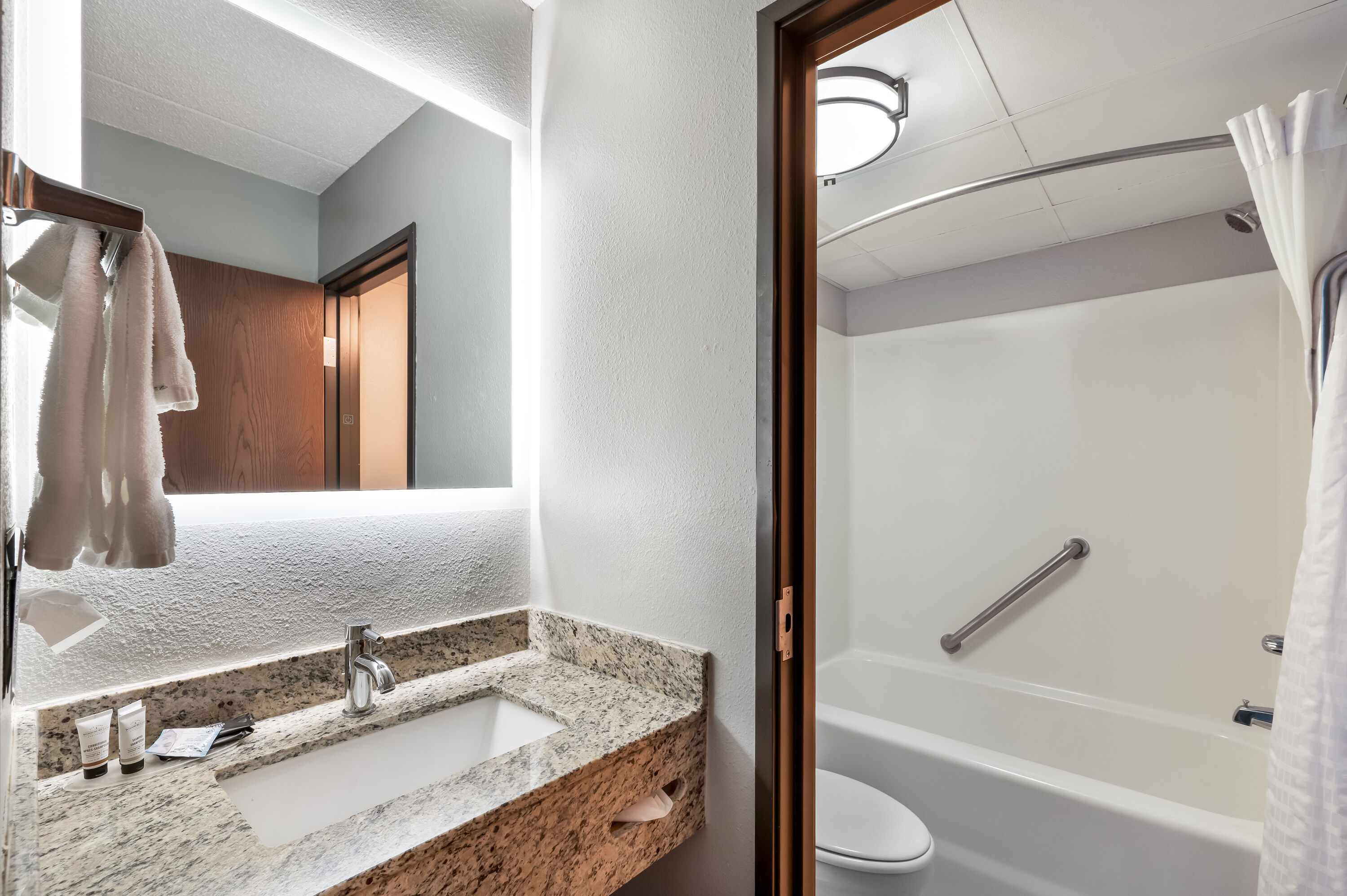 Guest room bath at the AmericInn by Wyndham Hutchinson in Hutchinson, Minnesota
