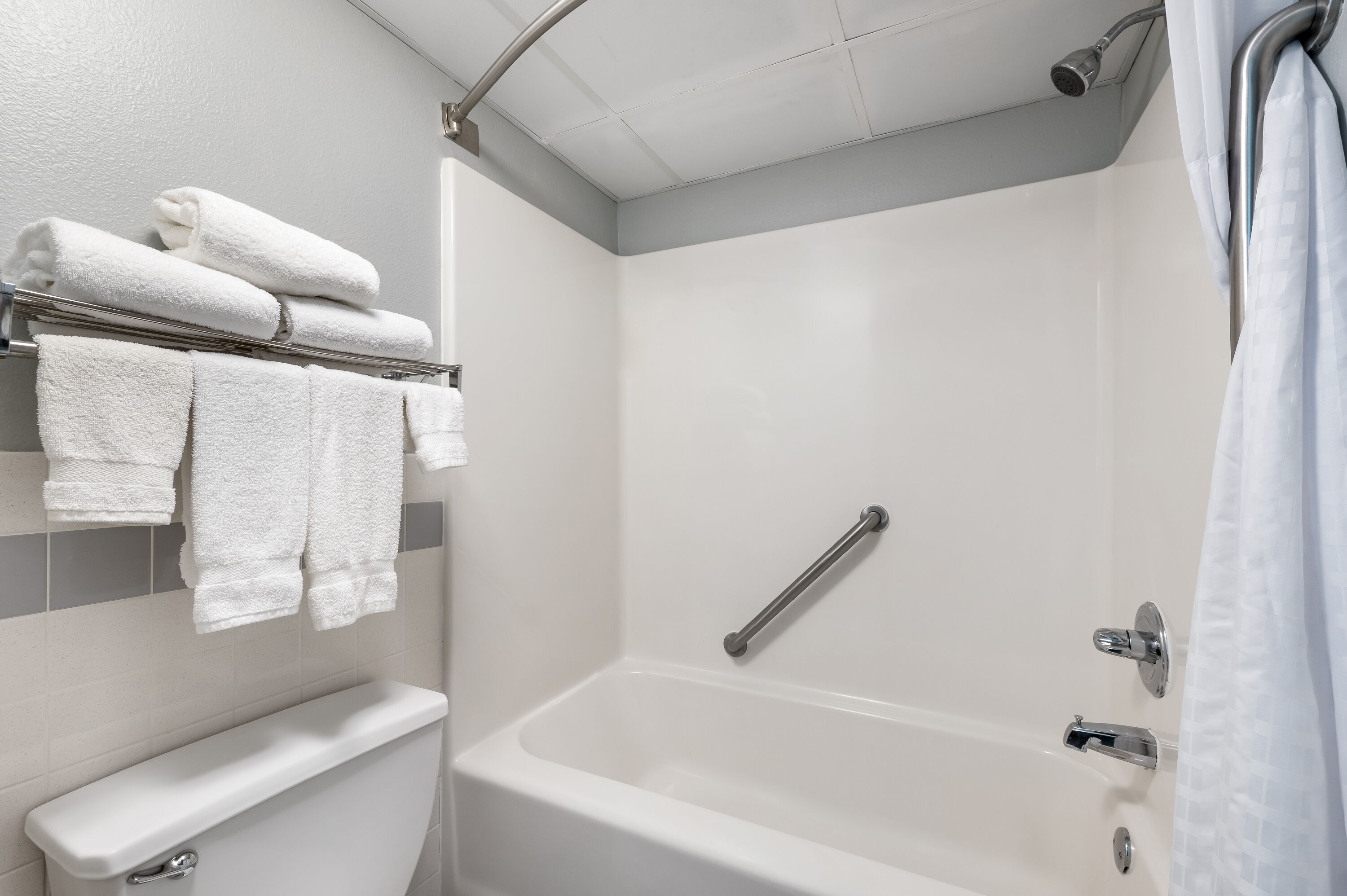 Guest room bath at the AmericInn by Wyndham Hutchinson in Hutchinson, Minnesota