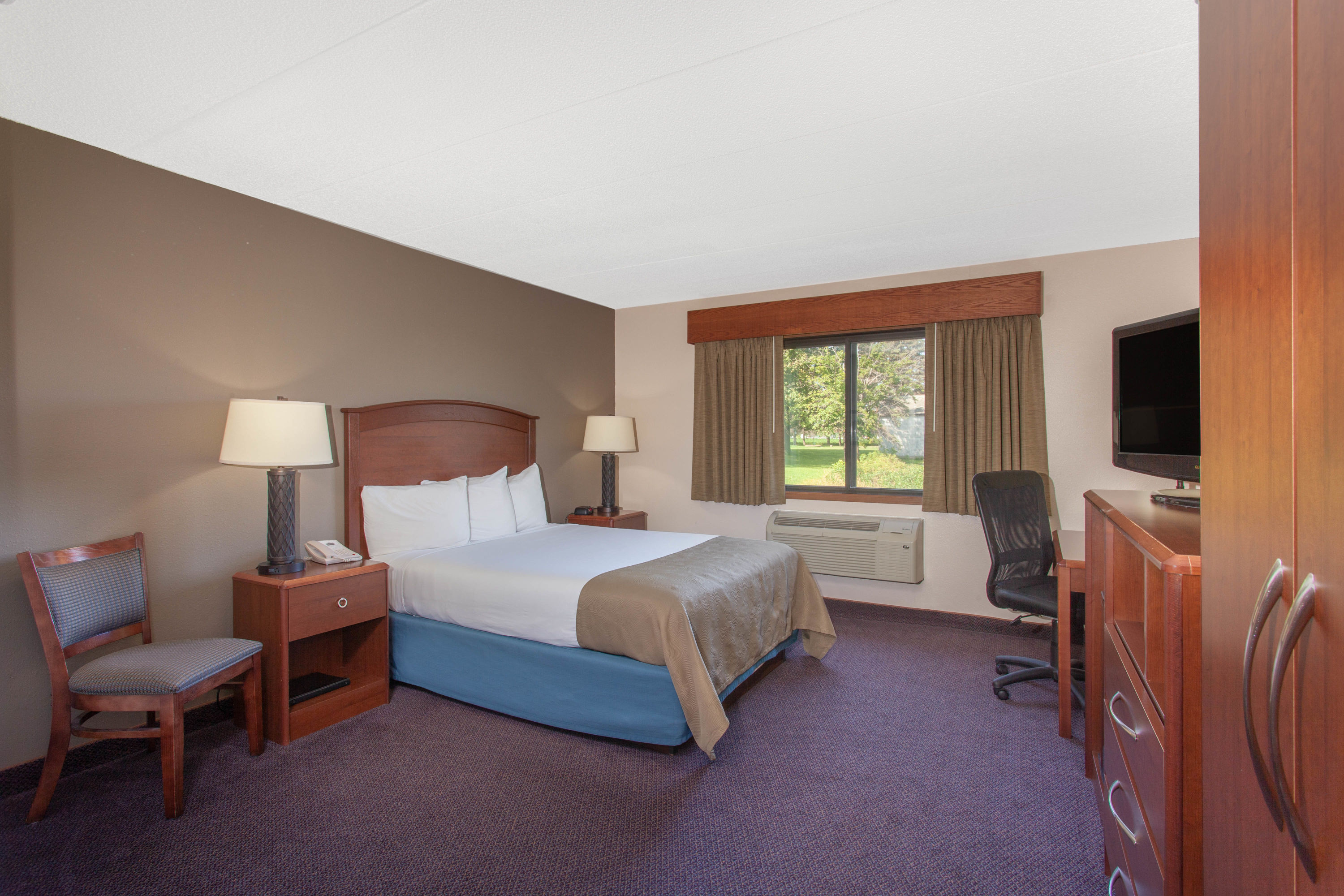 Guest room at the AmericInn by Wyndham Hutchinson in Hutchinson, Minnesota