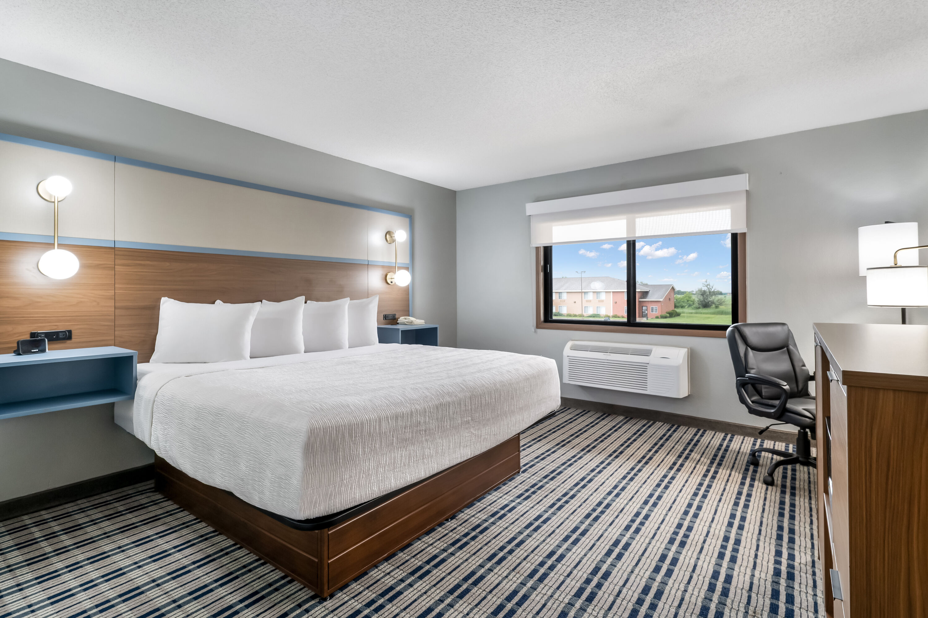 King bed guest room at the AmericInn by Wyndham Hutchinson in Hutchinson, Minnesota