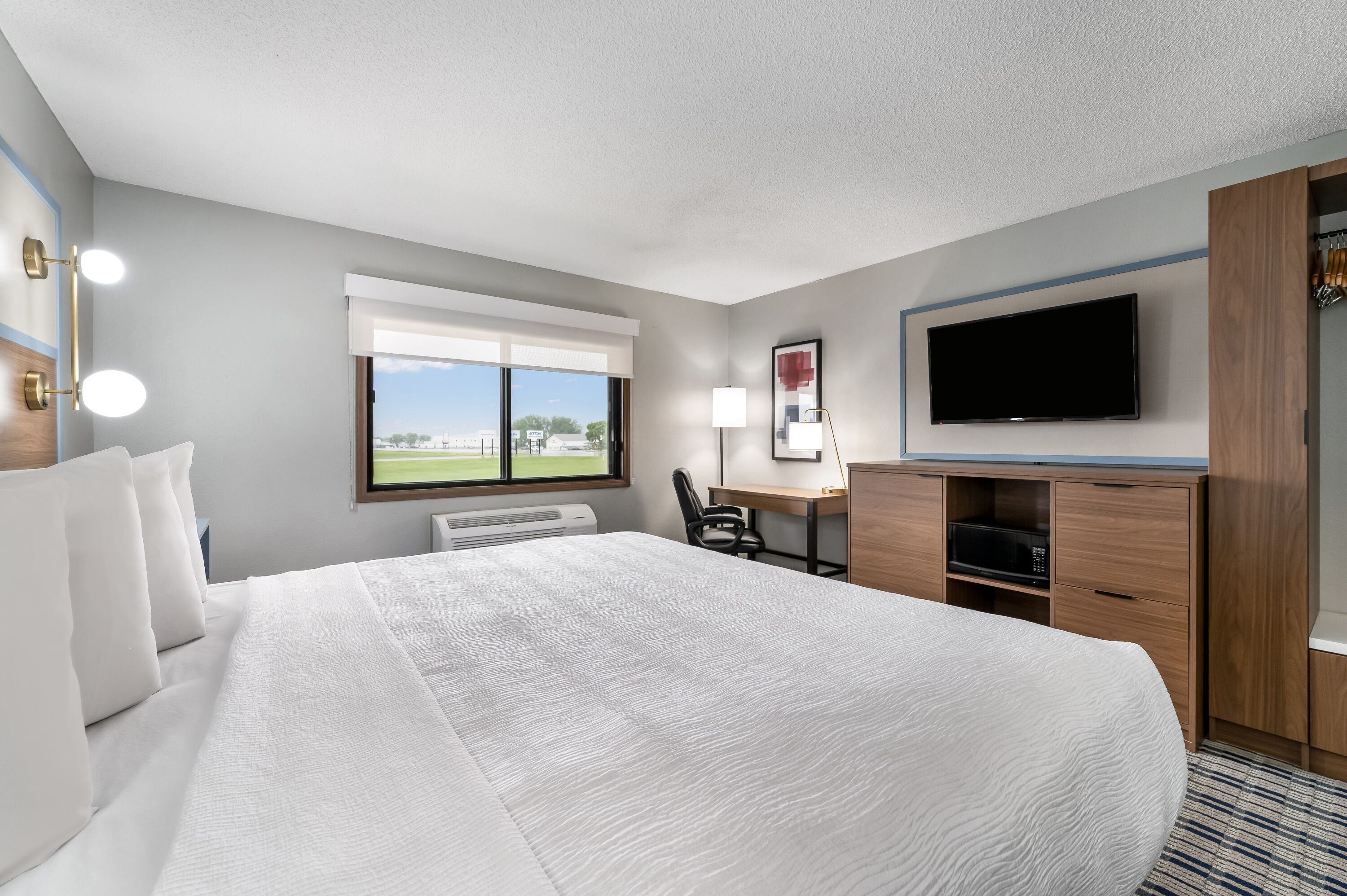 King bed guest room at the AmericInn by Wyndham Hutchinson in Hutchinson, Minnesota