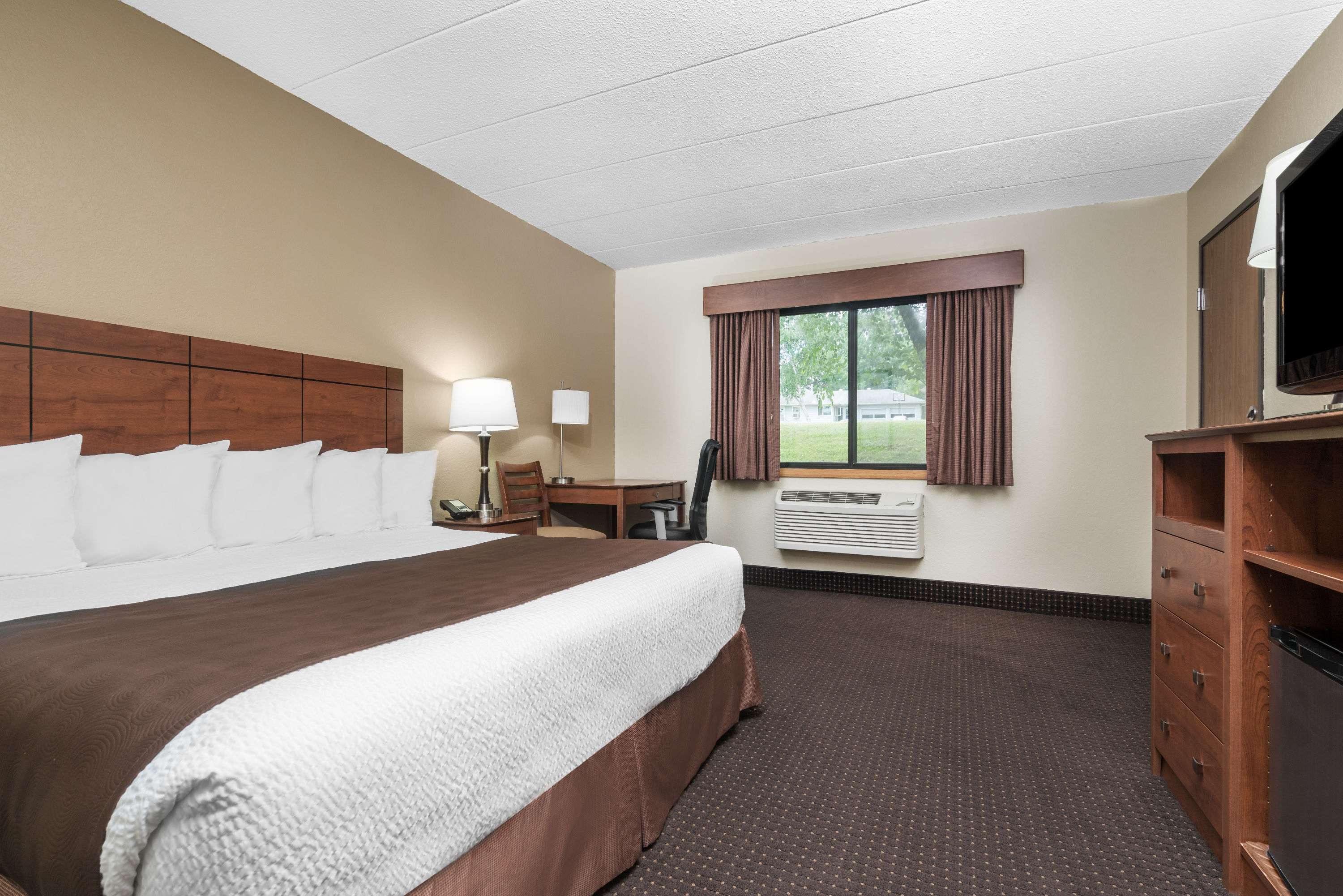 Guest room at the AmericInn by Wyndham Lake City in Lake City, Minnesota