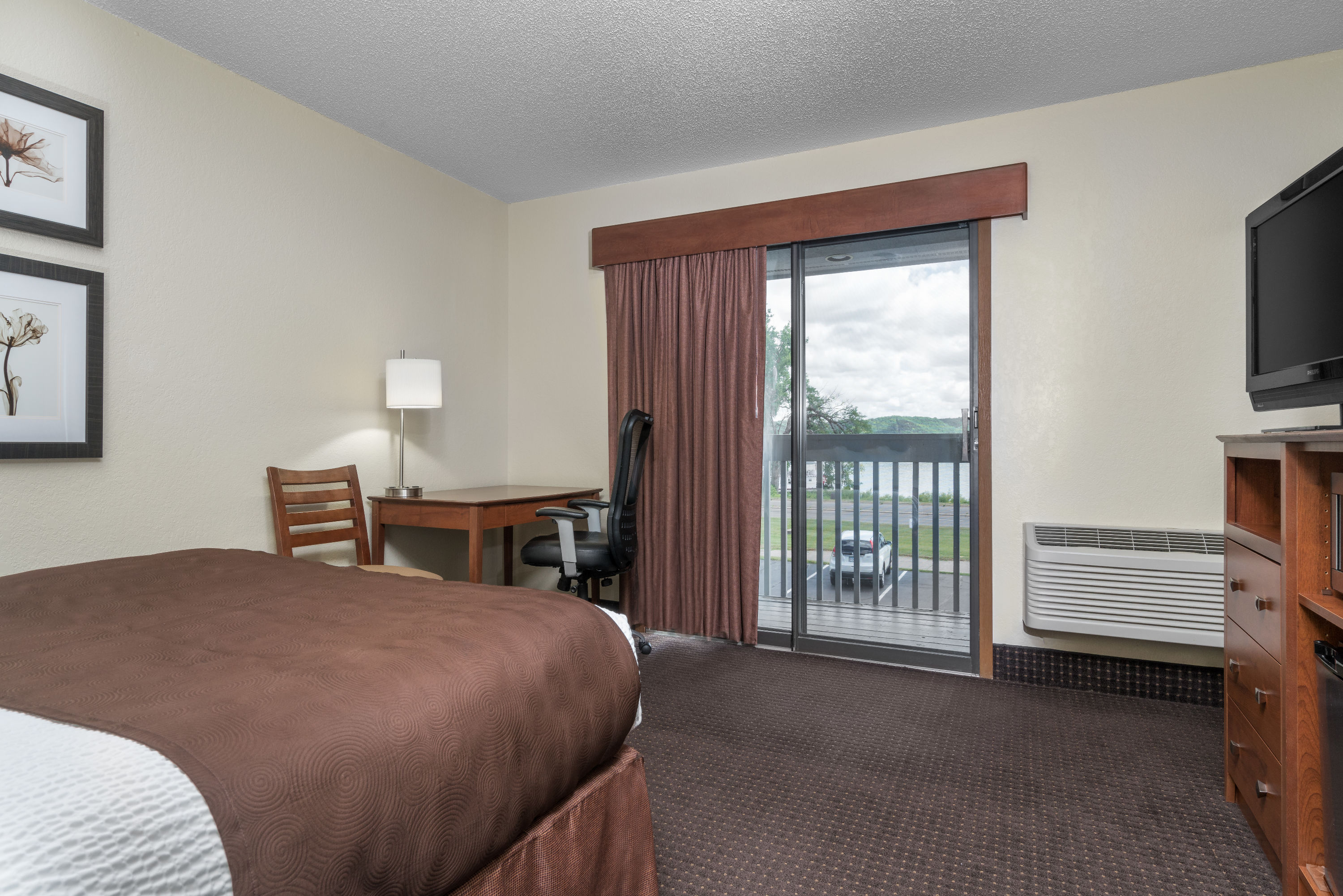 Guest room at the AmericInn by Wyndham Lake City in Lake City, Minnesota