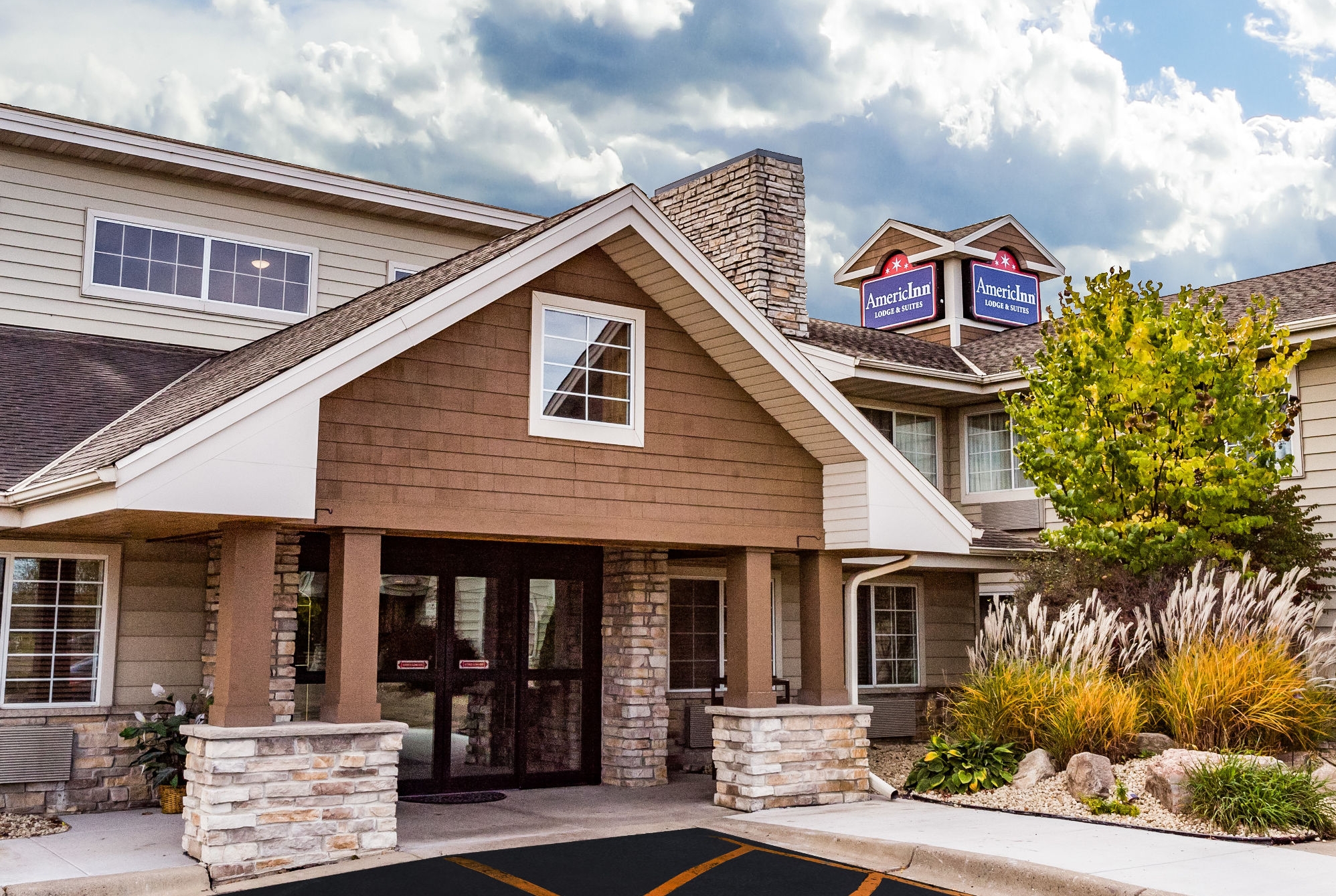 Exterior Day Image of AmericInn by Wyndham Hotel and Suites Long Lake hotel in Long Lake, Minnesota