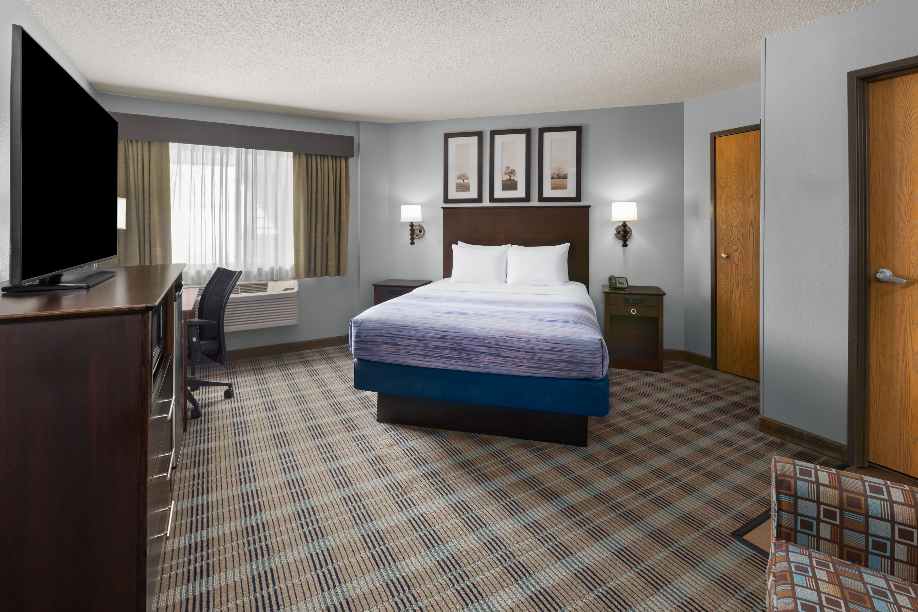 Guest room at the AmericInn by Wyndham Mankato Event Center in Mankato, Minnesota