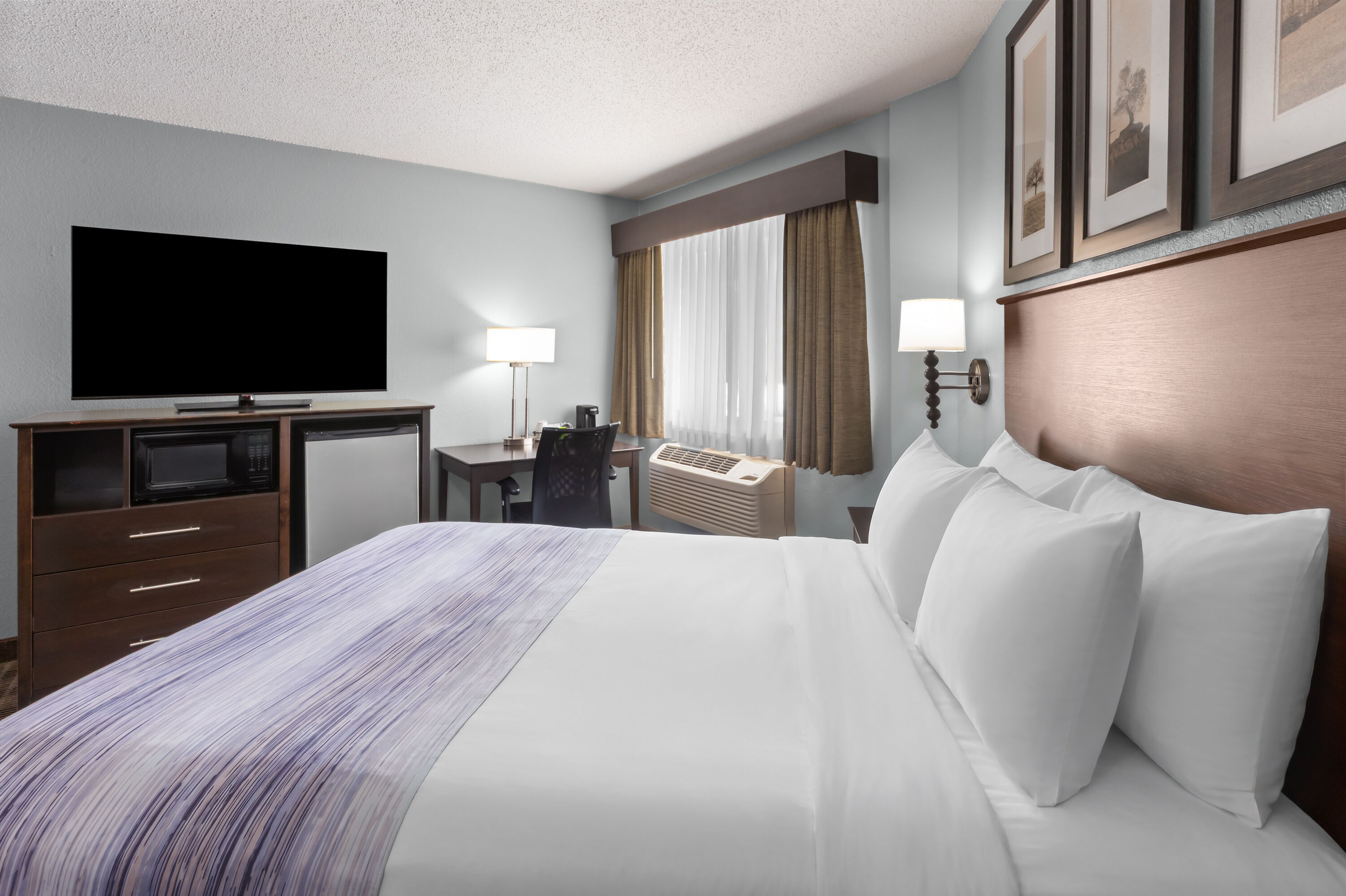 Guest room at the AmericInn by Wyndham Mankato Event Center in Mankato, Minnesota