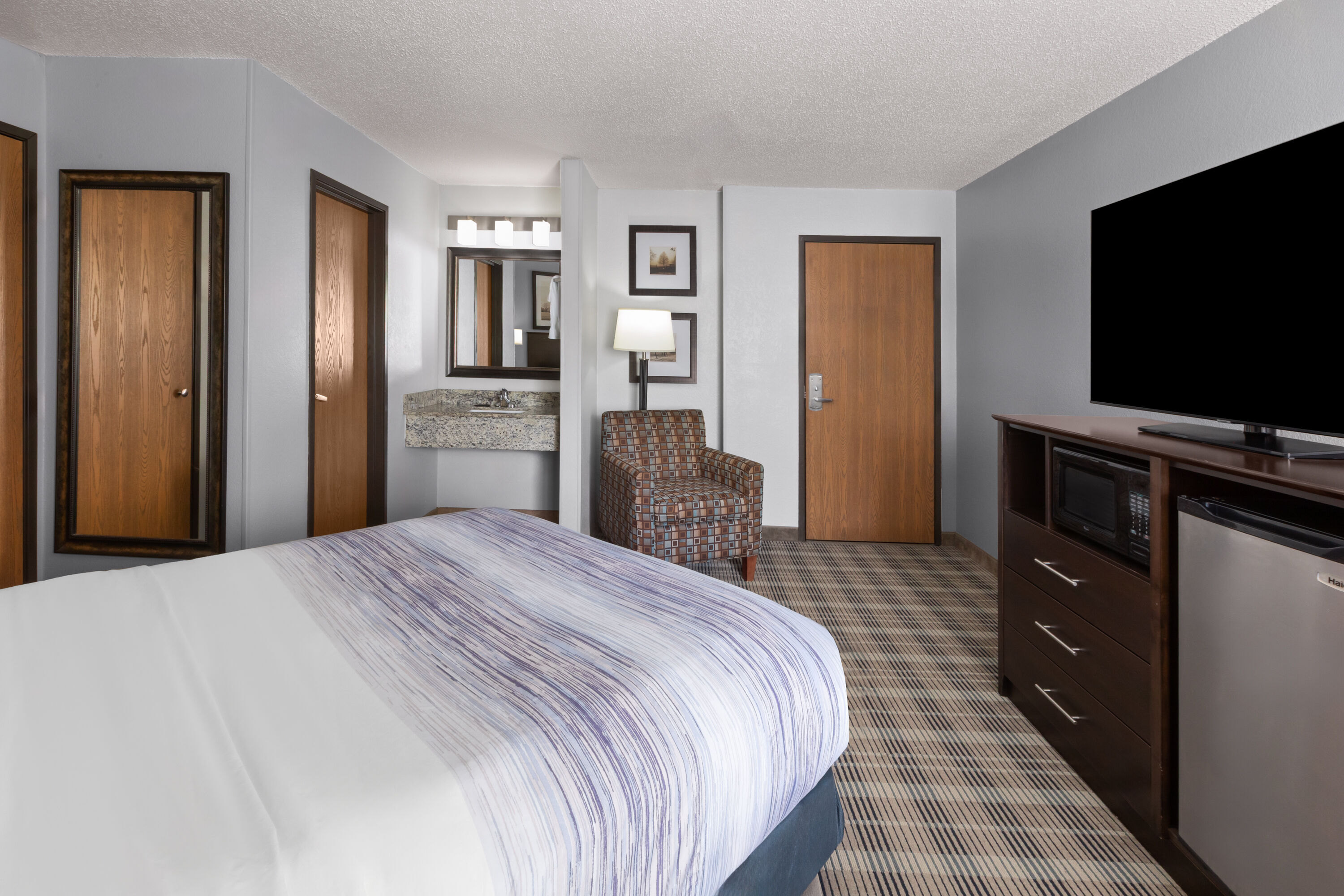 Guest room at the AmericInn by Wyndham Mankato Event Center in Mankato, Minnesota