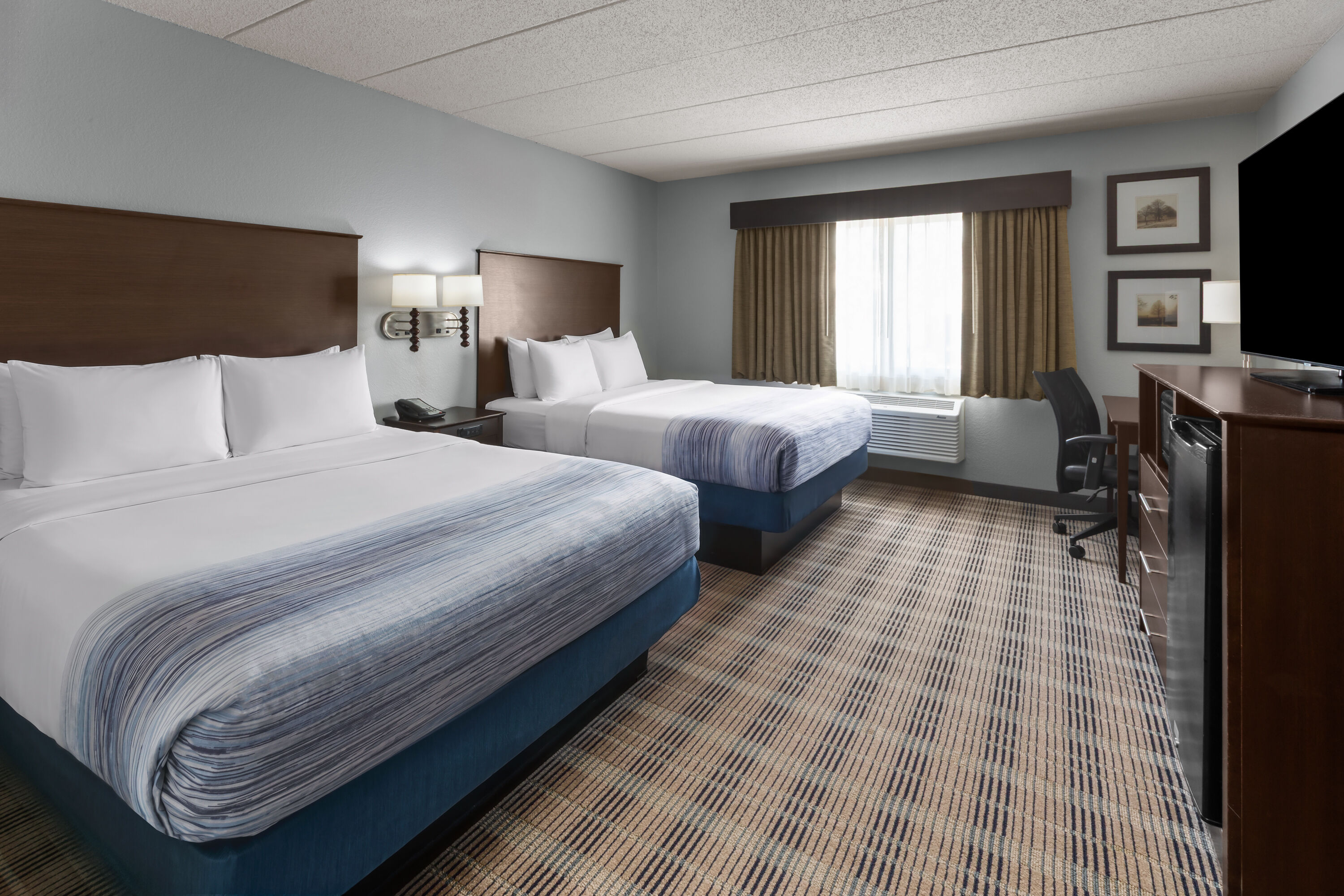 Guest room at the AmericInn by Wyndham Mankato Event Center in Mankato, Minnesota