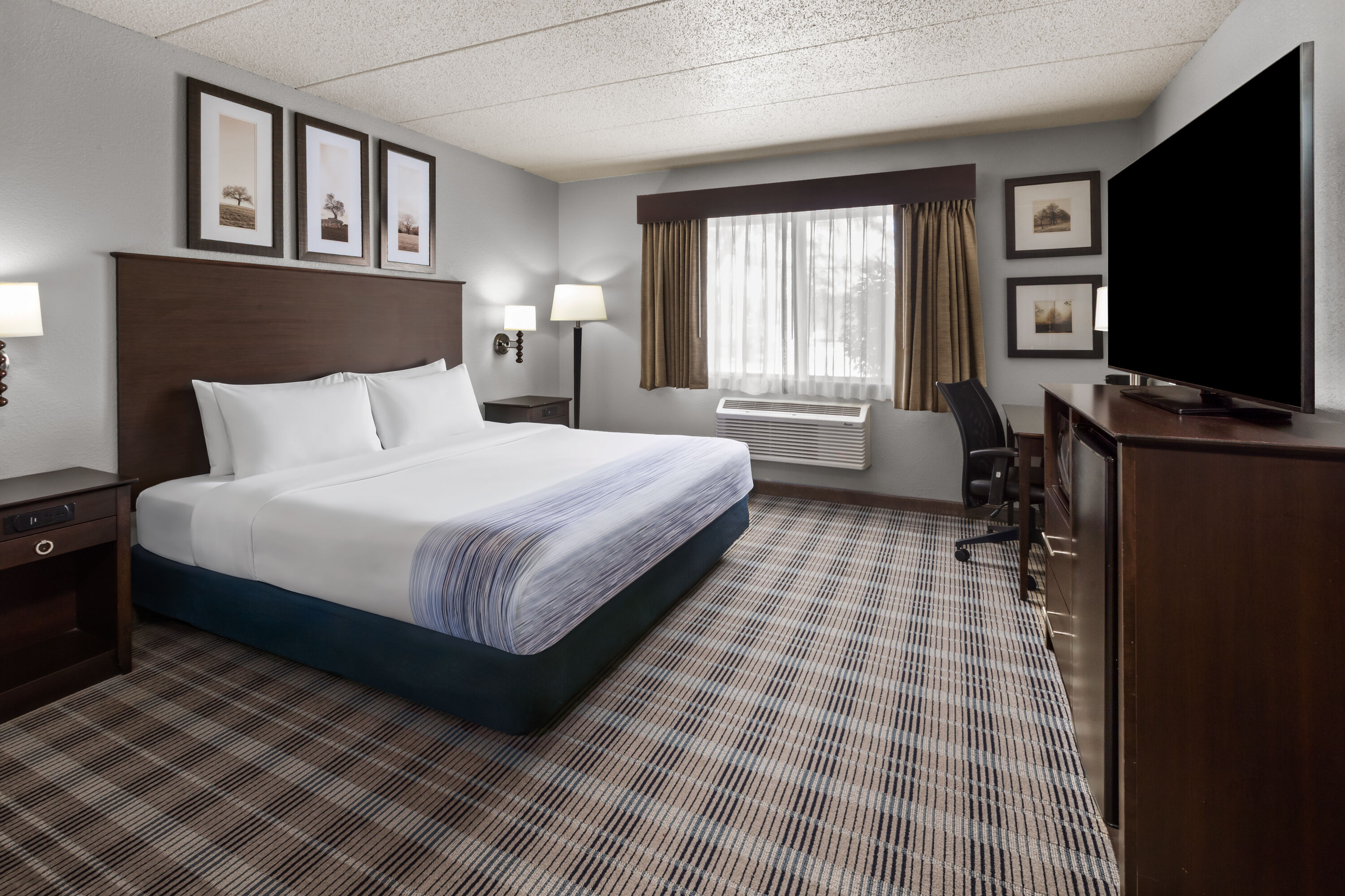 Guest room at the AmericInn by Wyndham Mankato Event Center in Mankato, Minnesota