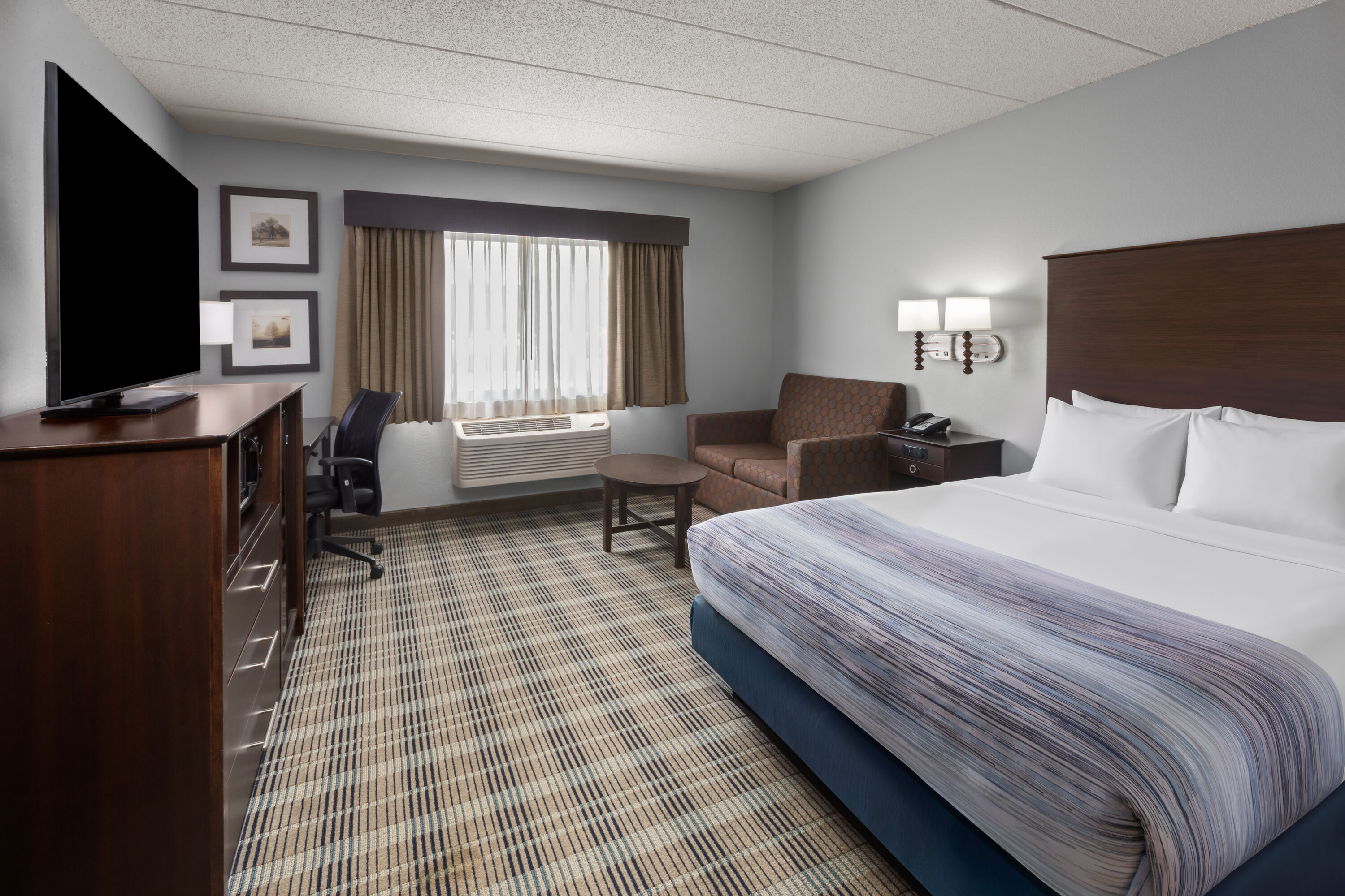 Guest room at the AmericInn by Wyndham Mankato Event Center in Mankato, Minnesota