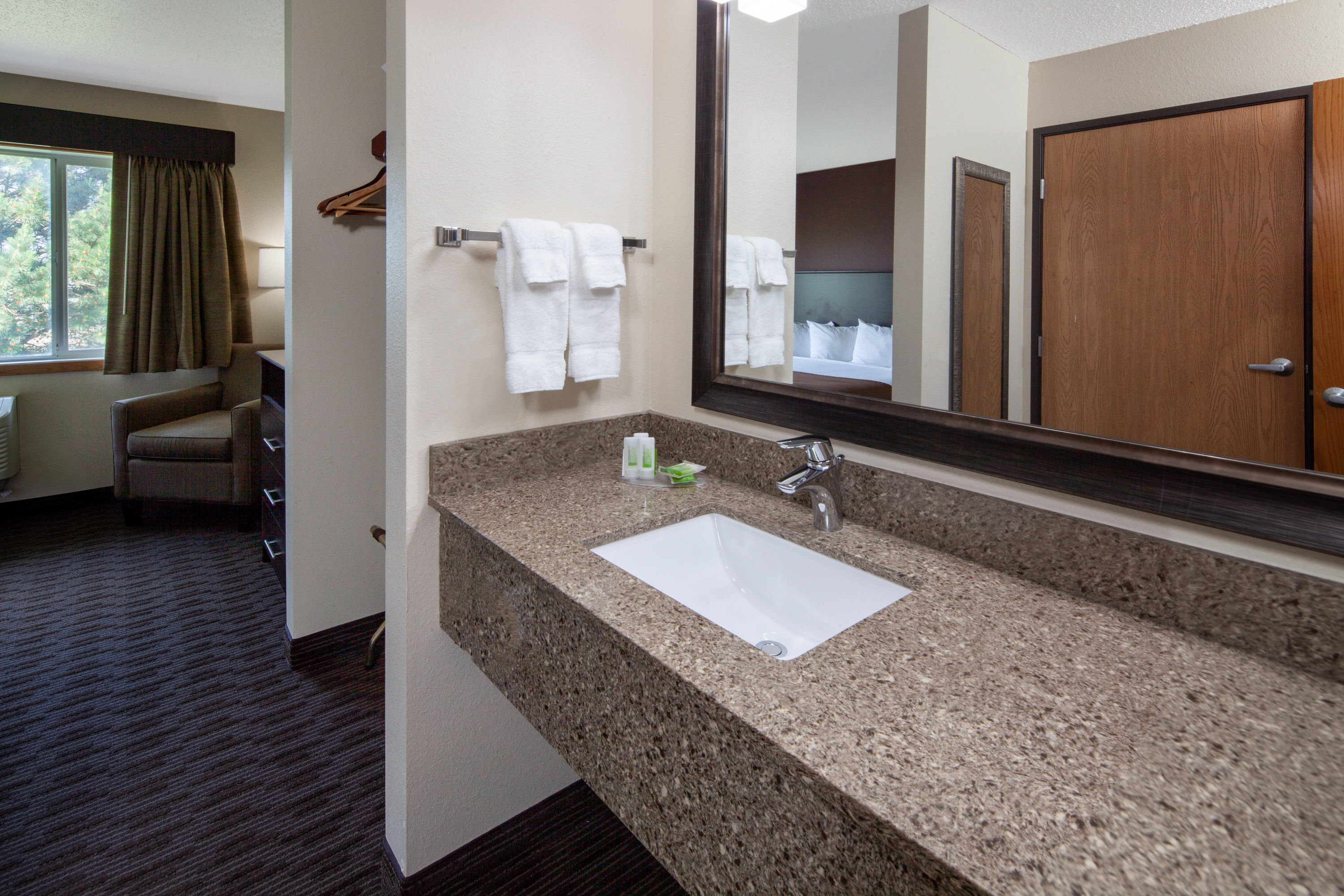 Guest room bath at the AmericInn by Wyndham Northfield in Northfield, Minnesota