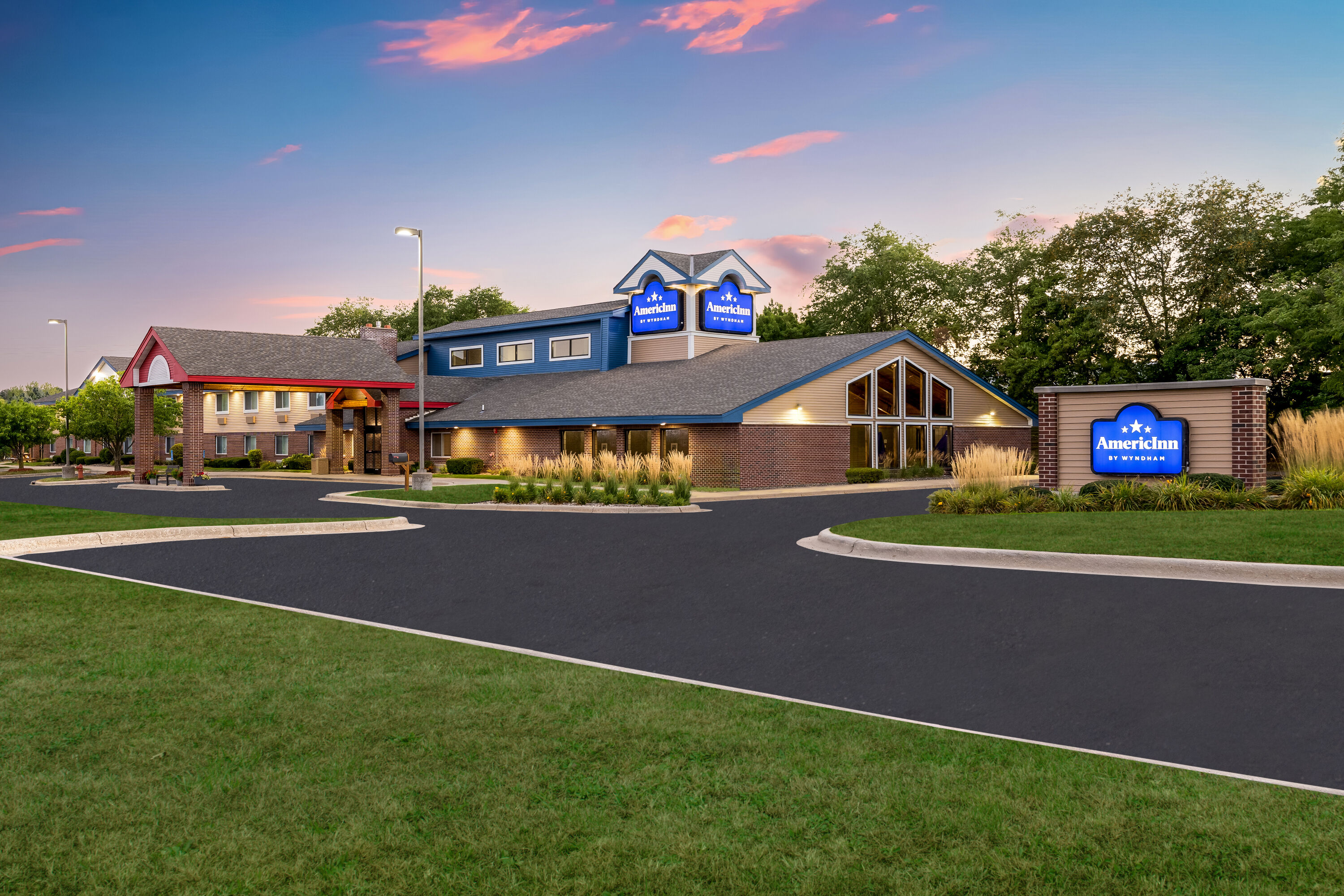 Exterior Dusk Image of AmericInn by Wyndham Stillwater hotel in Oak Park Heights, Minnesota