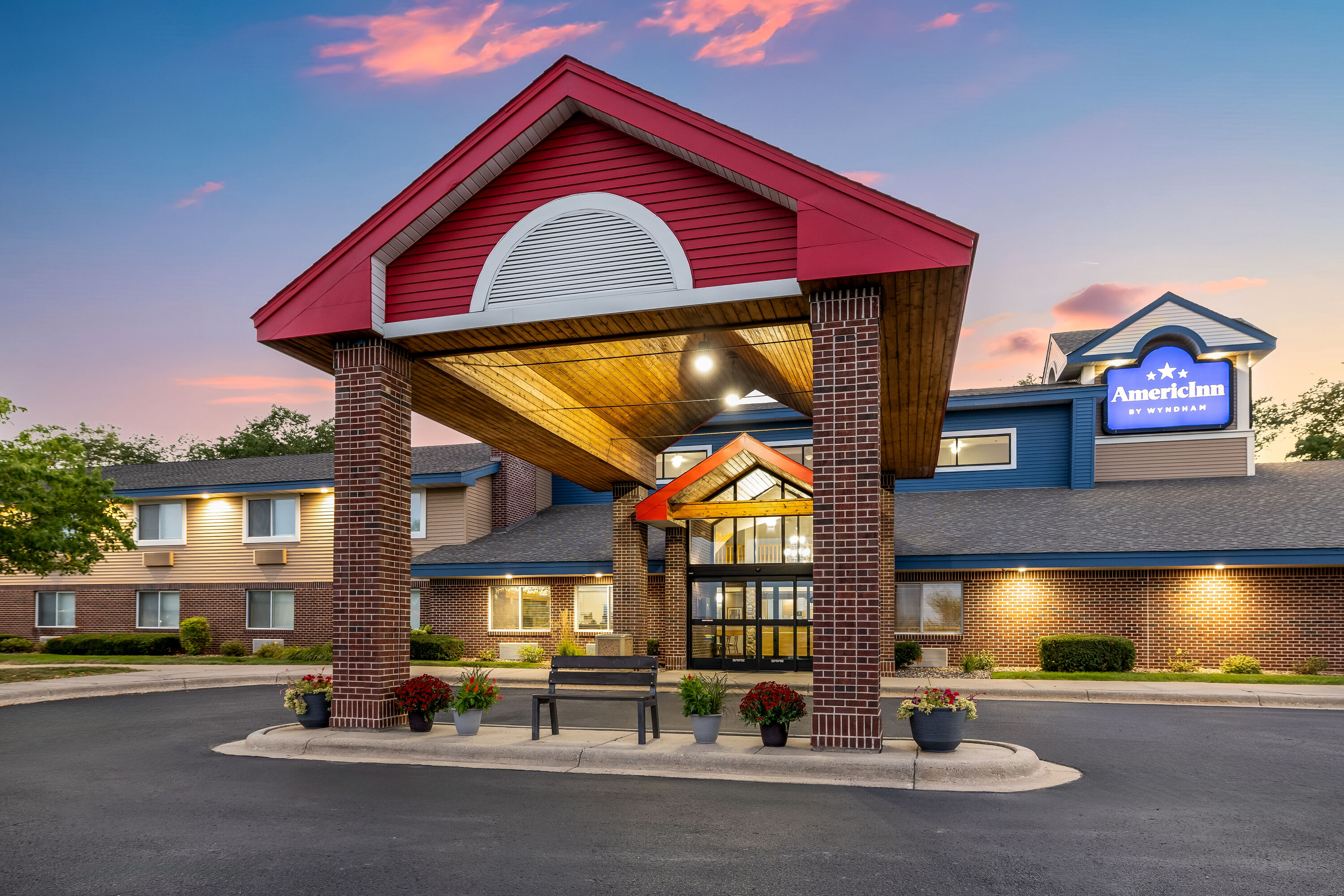 Exterior Dusk Image of AmericInn by Wyndham Stillwater hotel in Oak Park Heights, Minnesota