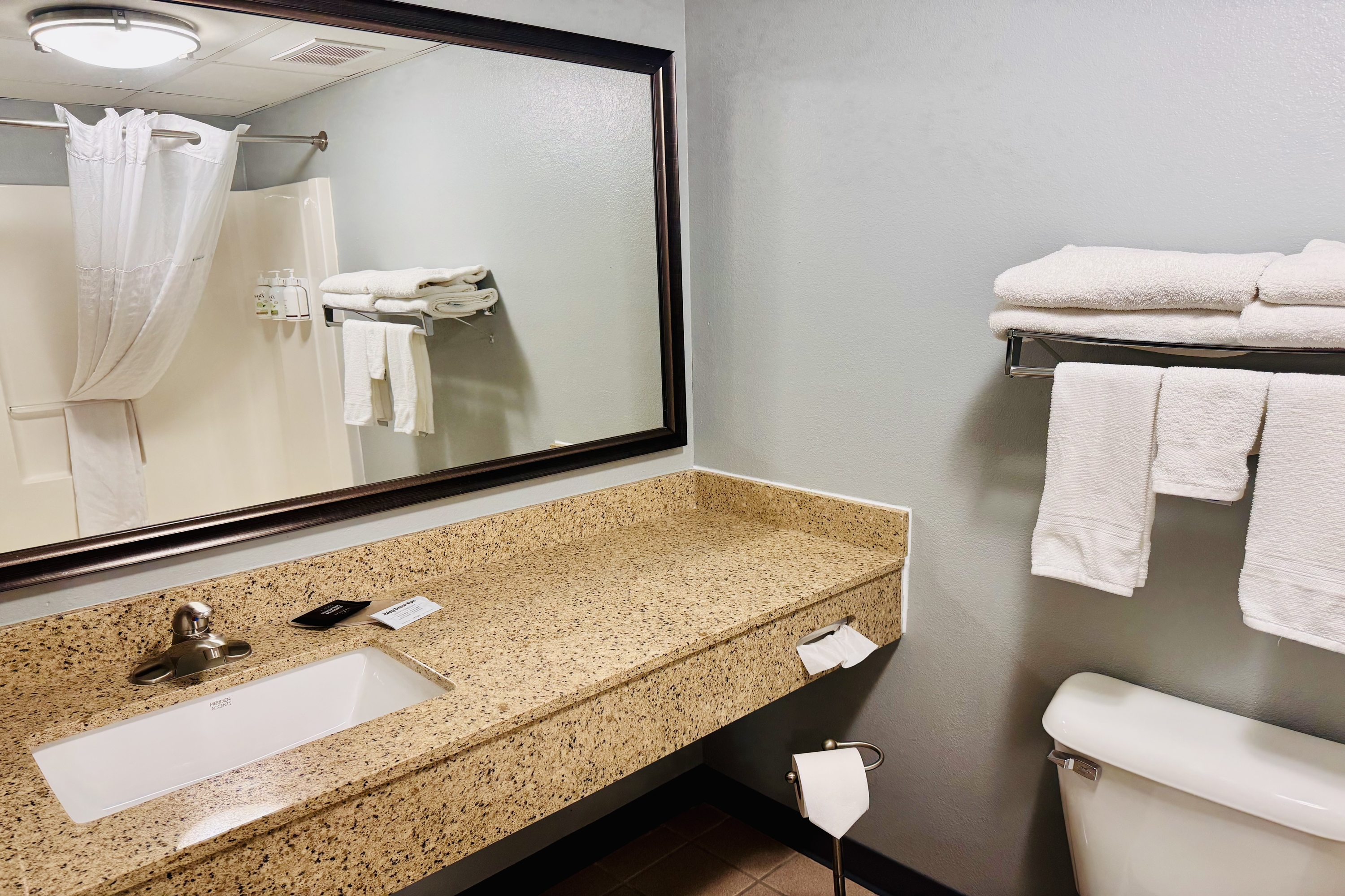 Guest room bath at the AmericInn by Wyndham Stillwater in Oak Park Heights, Minnesota