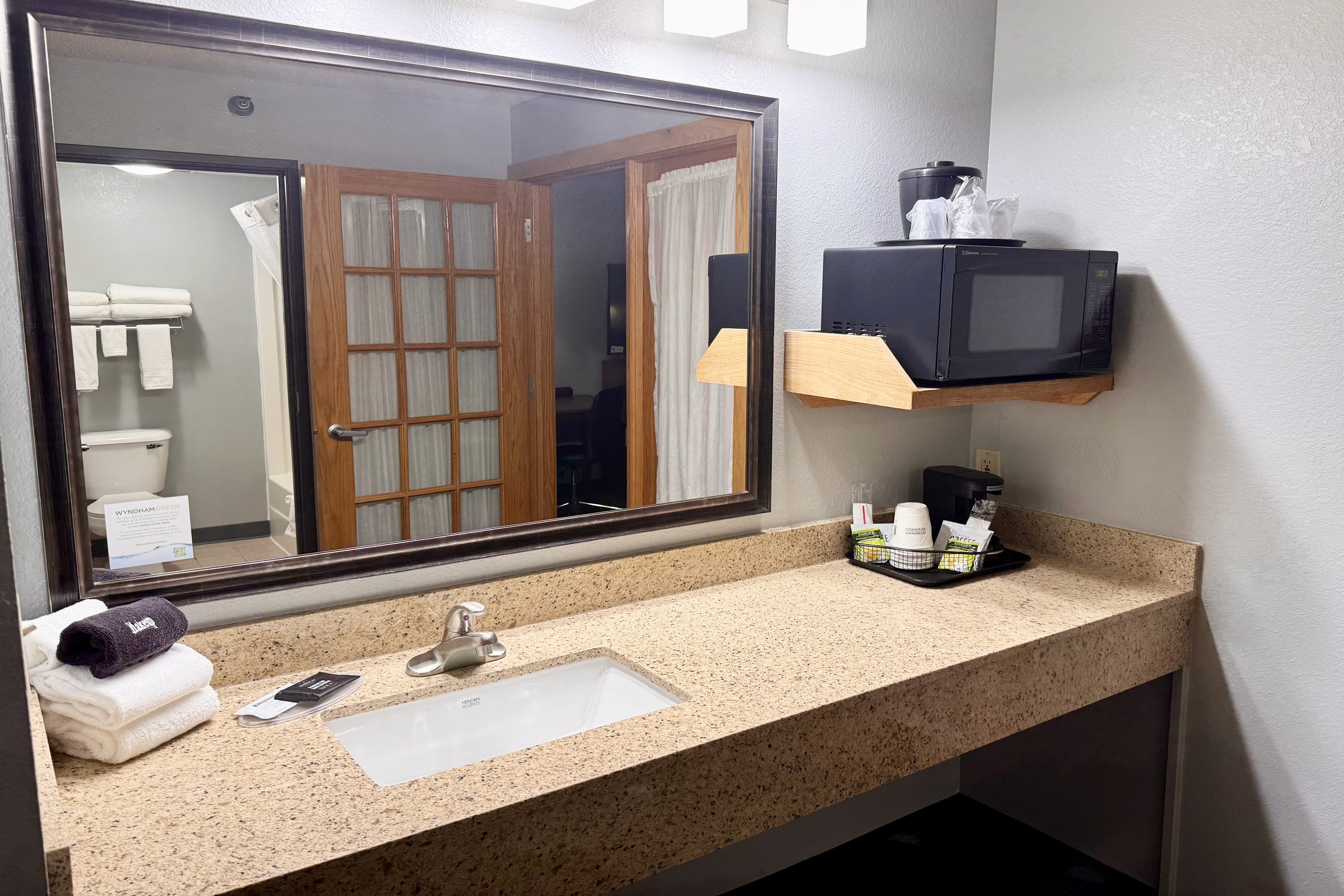 Guest room bath at the AmericInn by Wyndham Stillwater in Oak Park Heights, Minnesota