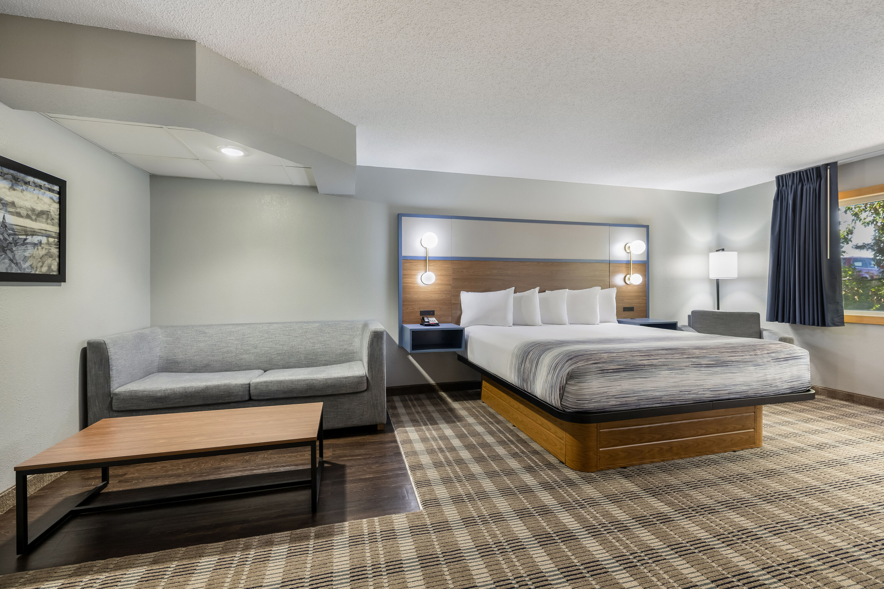 King bed guest room at the AmericInn by Wyndham Stillwater in Oak Park Heights, Minnesota
