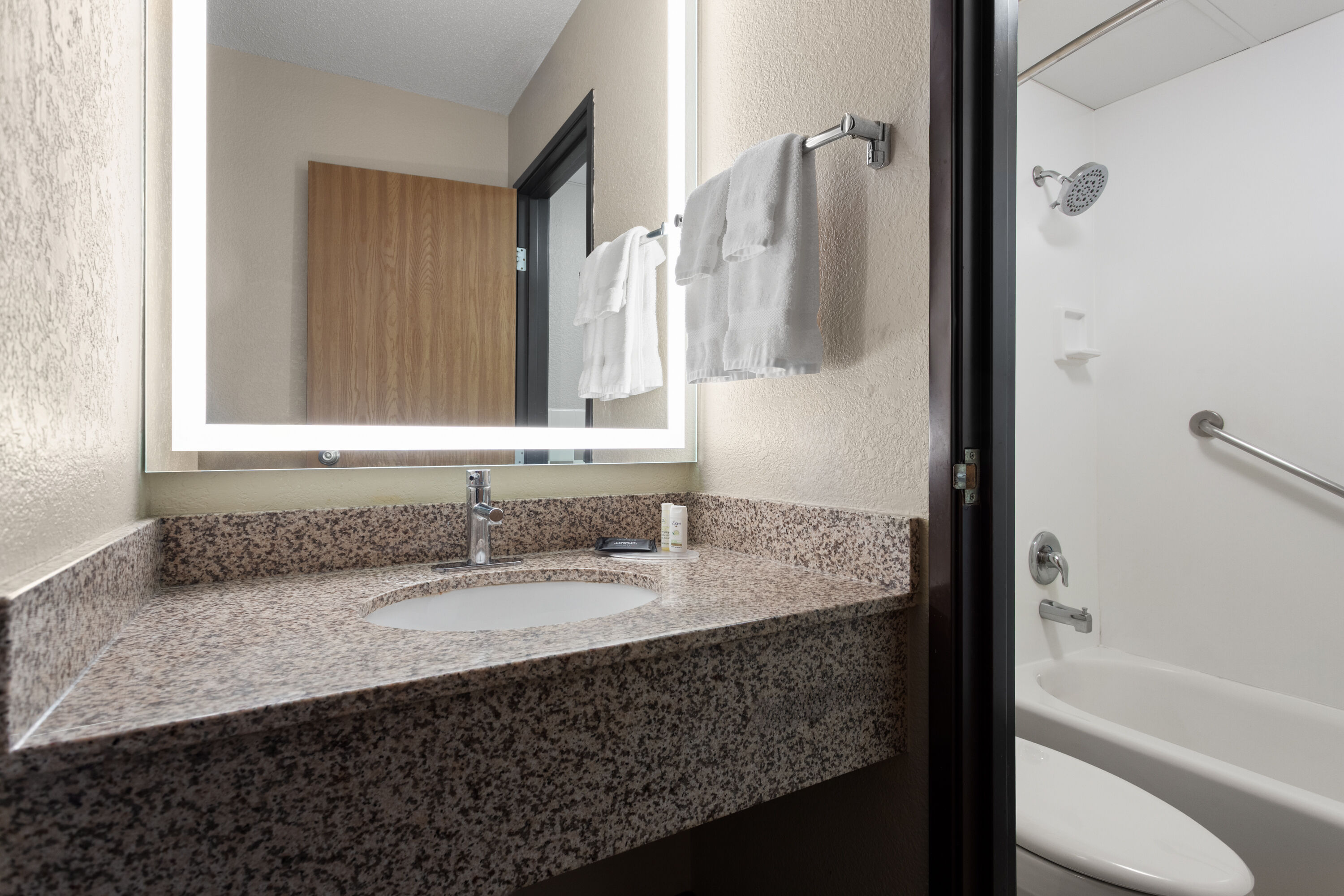 Guest room bath at the AmericInn by Wyndham Roseau in Roseau, Minnesota