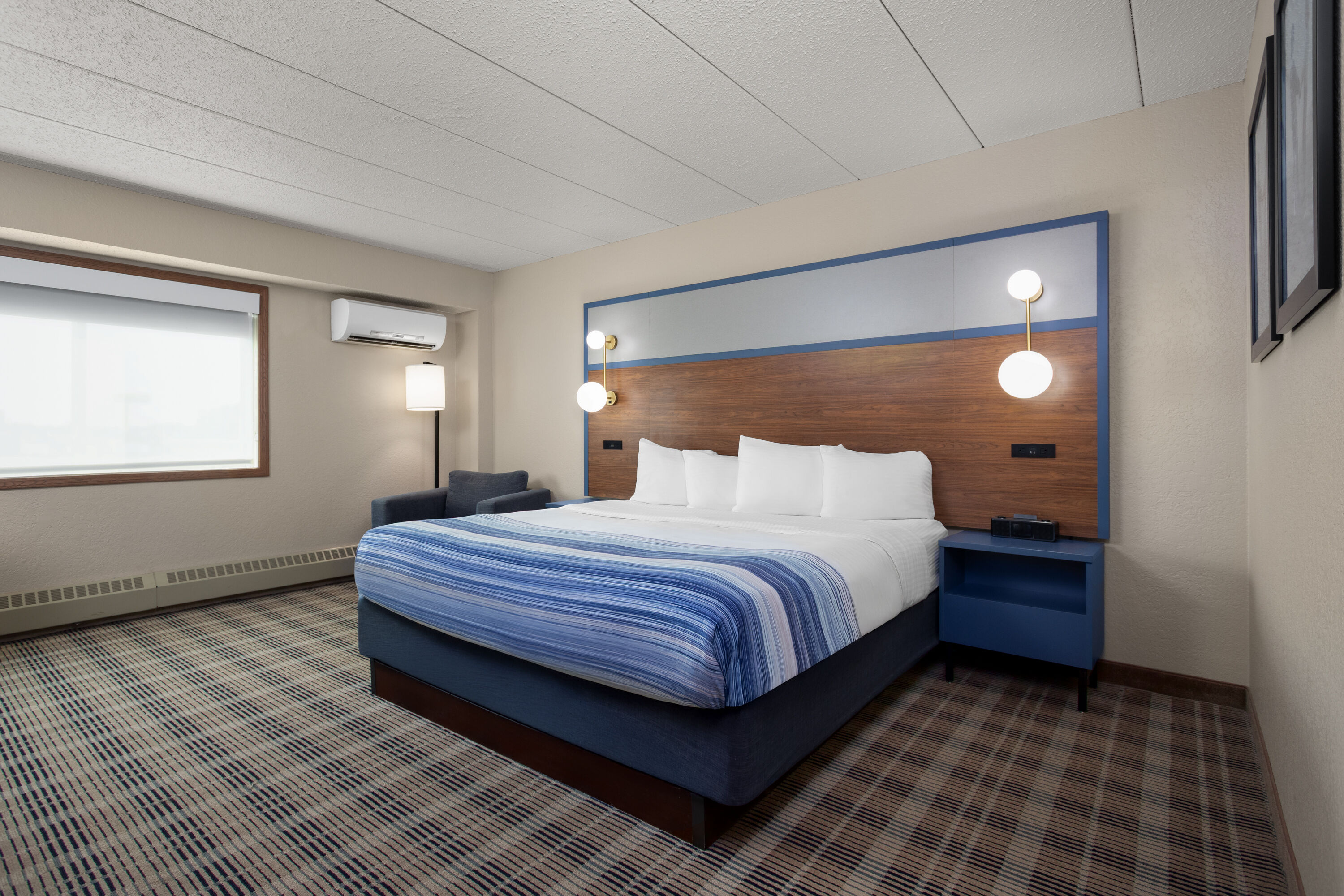 Guest room at the AmericInn by Wyndham Roseau in Roseau, Minnesota