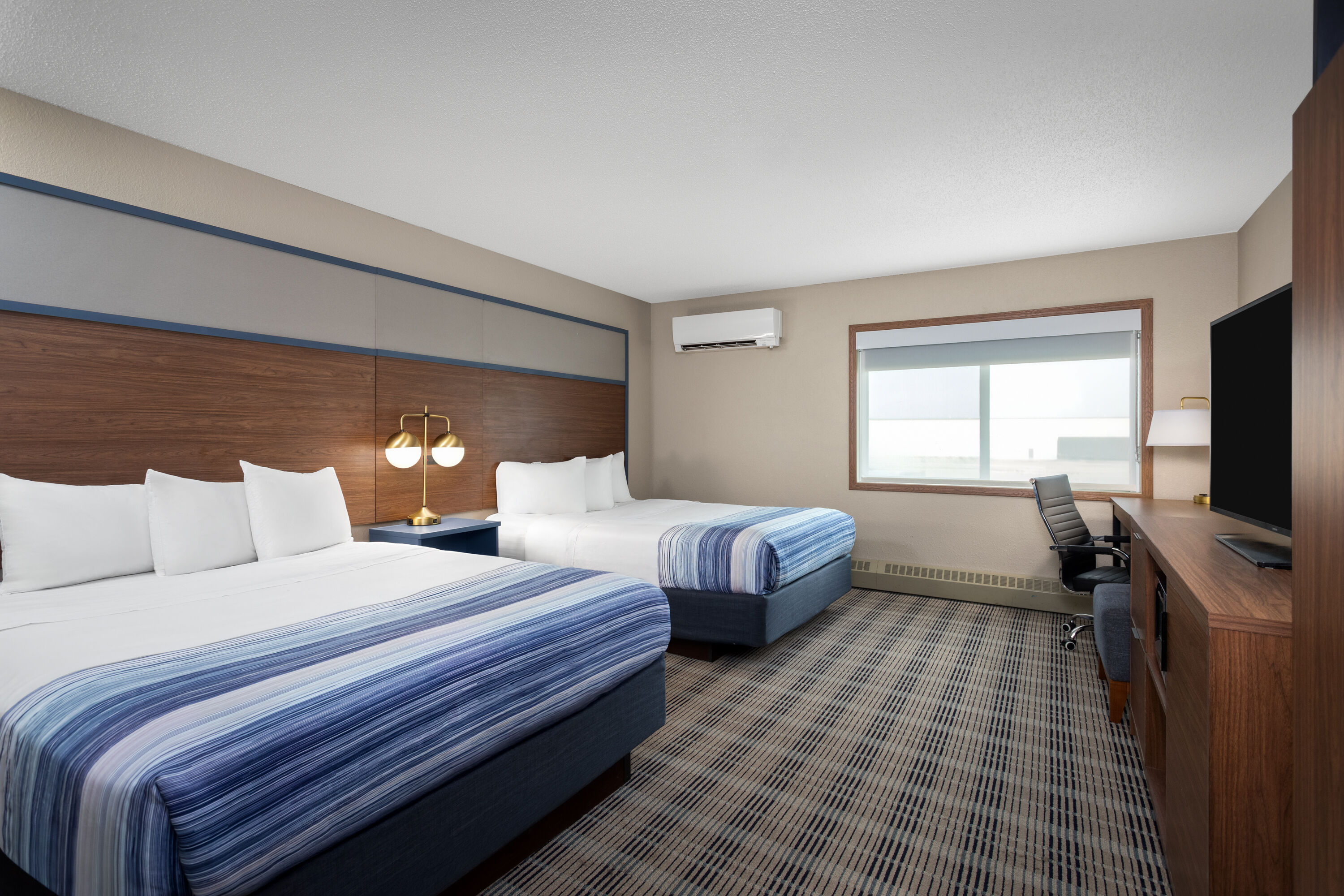 Guest room at the AmericInn by Wyndham Roseau in Roseau, Minnesota