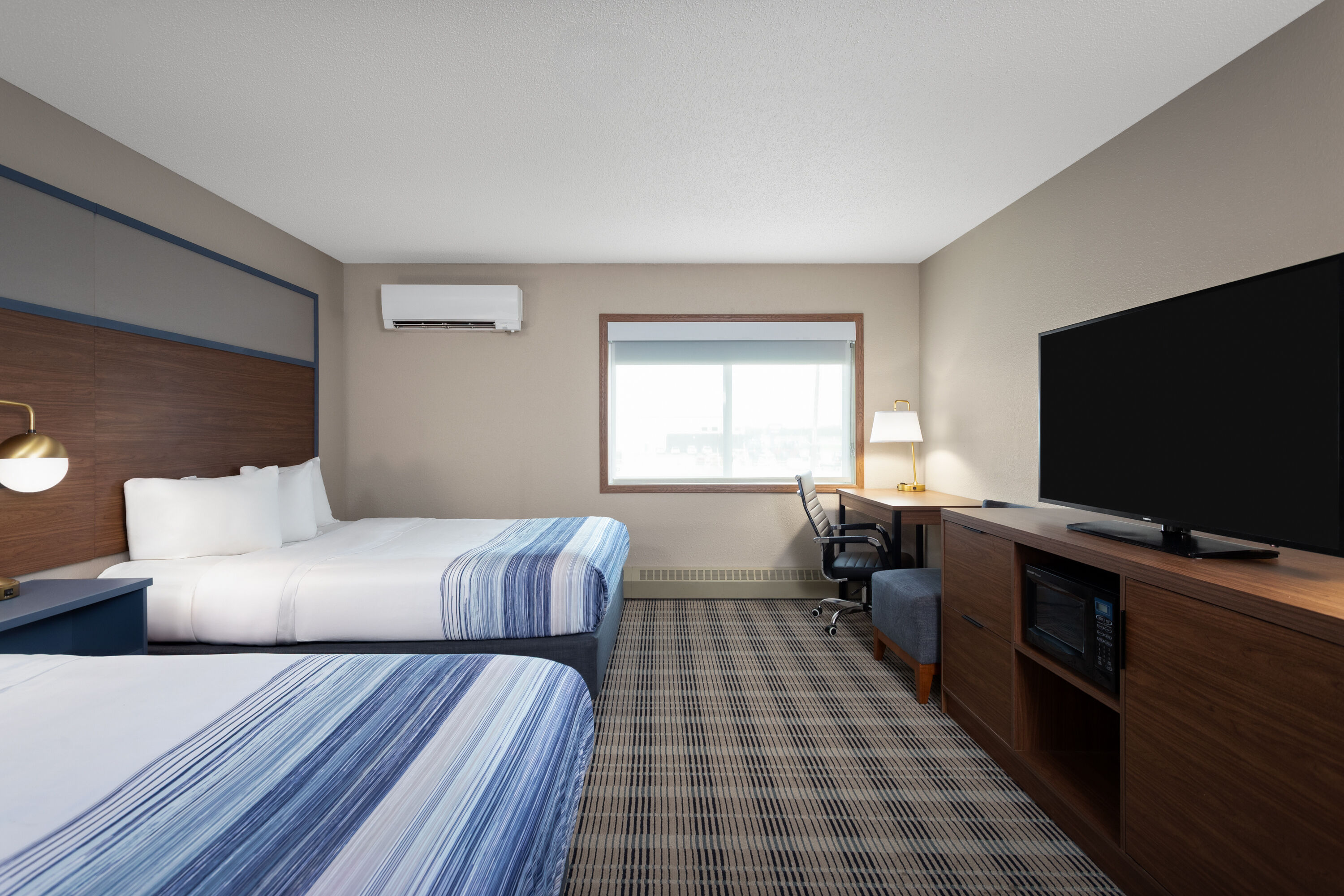 Guest room at the AmericInn by Wyndham Roseau in Roseau, Minnesota