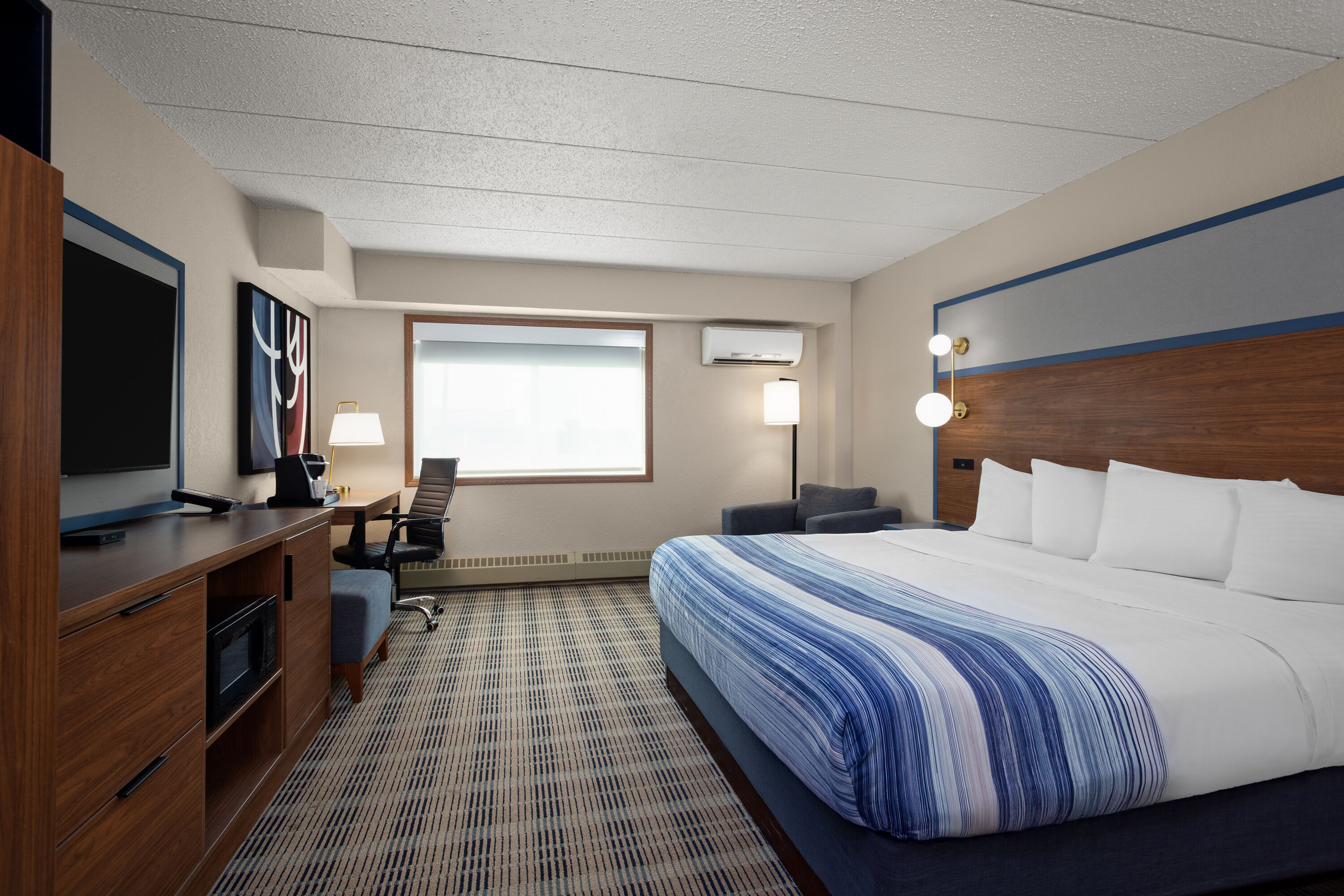 Guest room at the AmericInn by Wyndham Roseau in Roseau, Minnesota