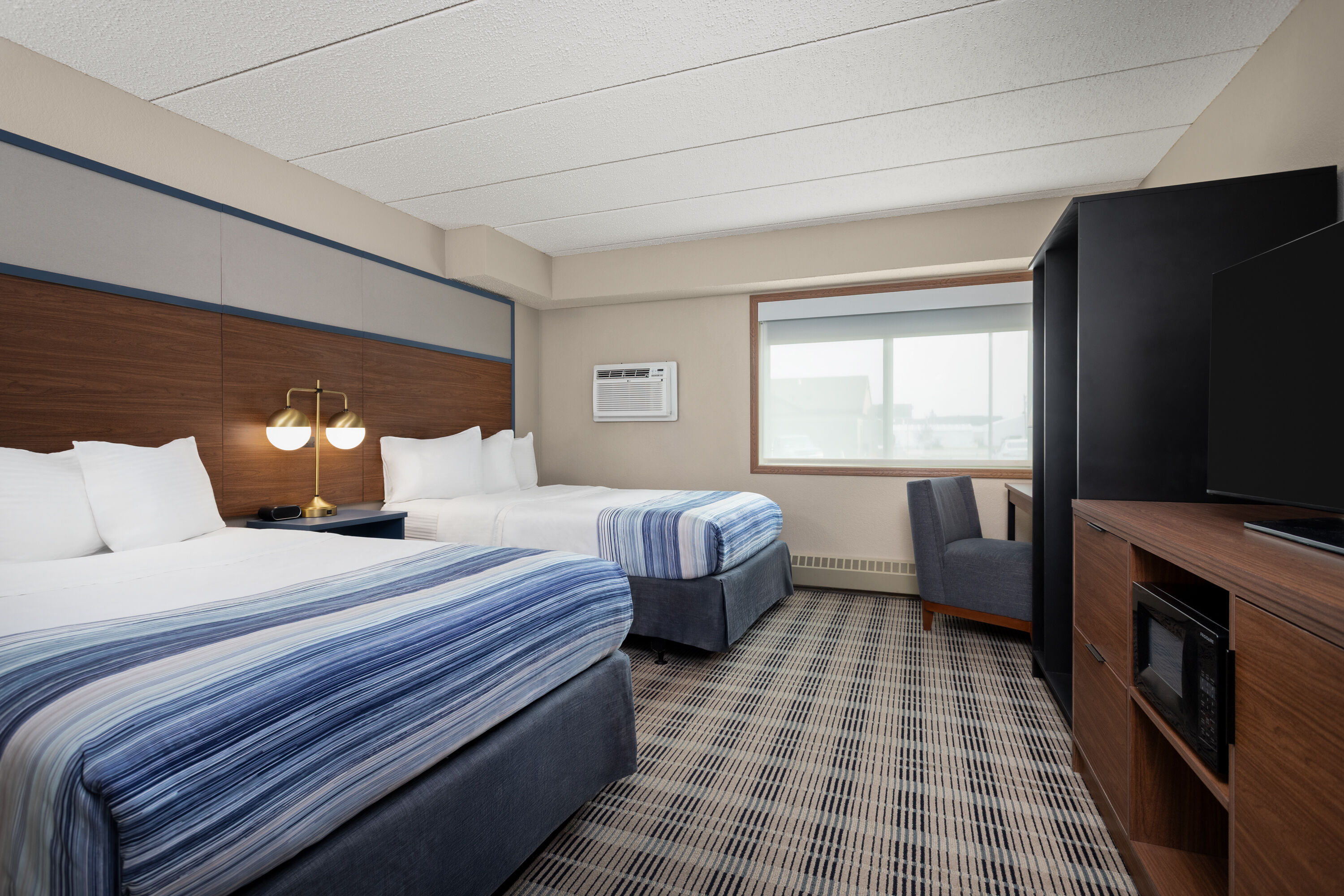 Guest room at the AmericInn by Wyndham Roseau in Roseau, Minnesota