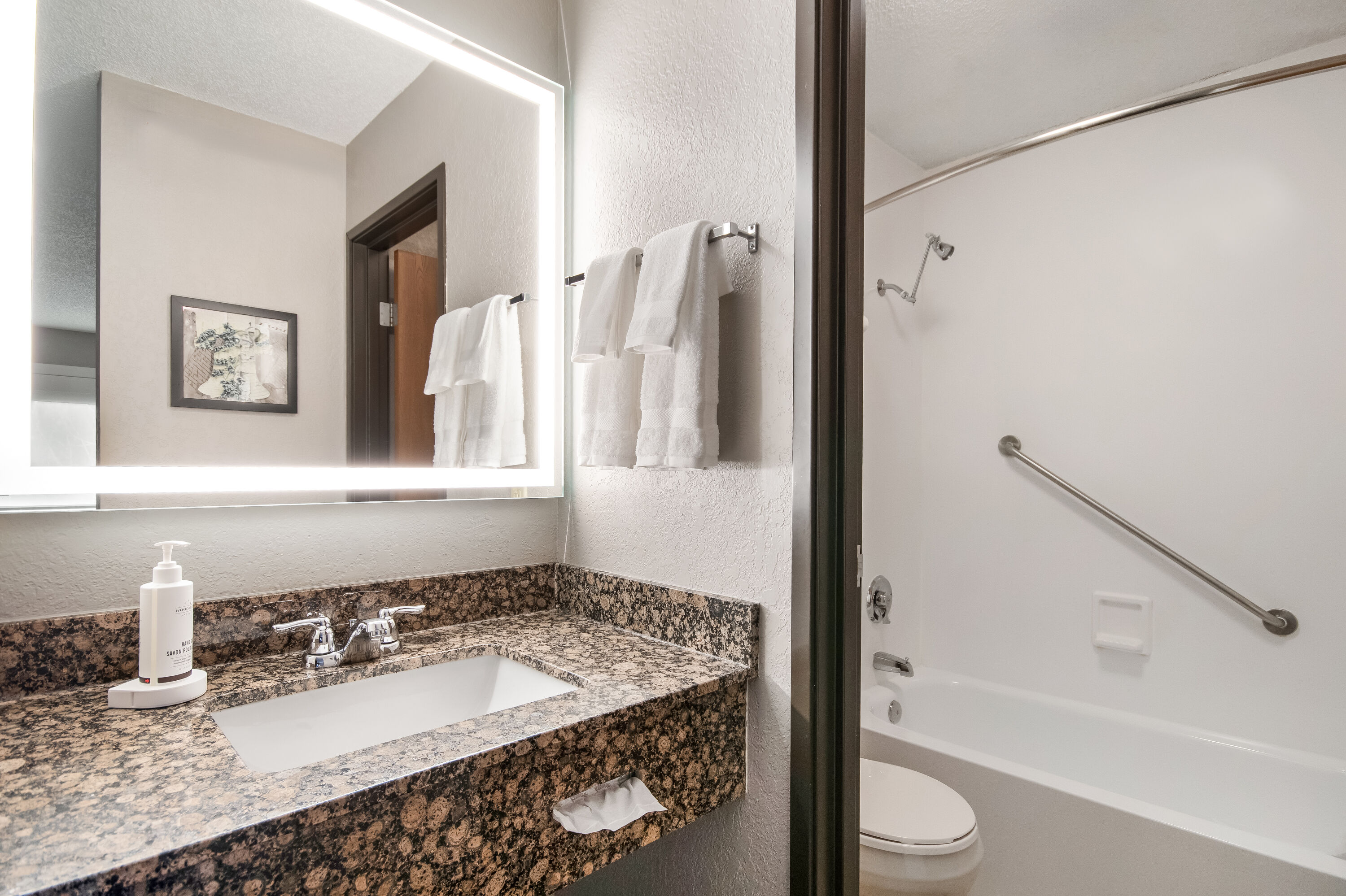 Guest room bath at the AmericInn by Wyndham St. Peter in Saint Peter, Minnesota
