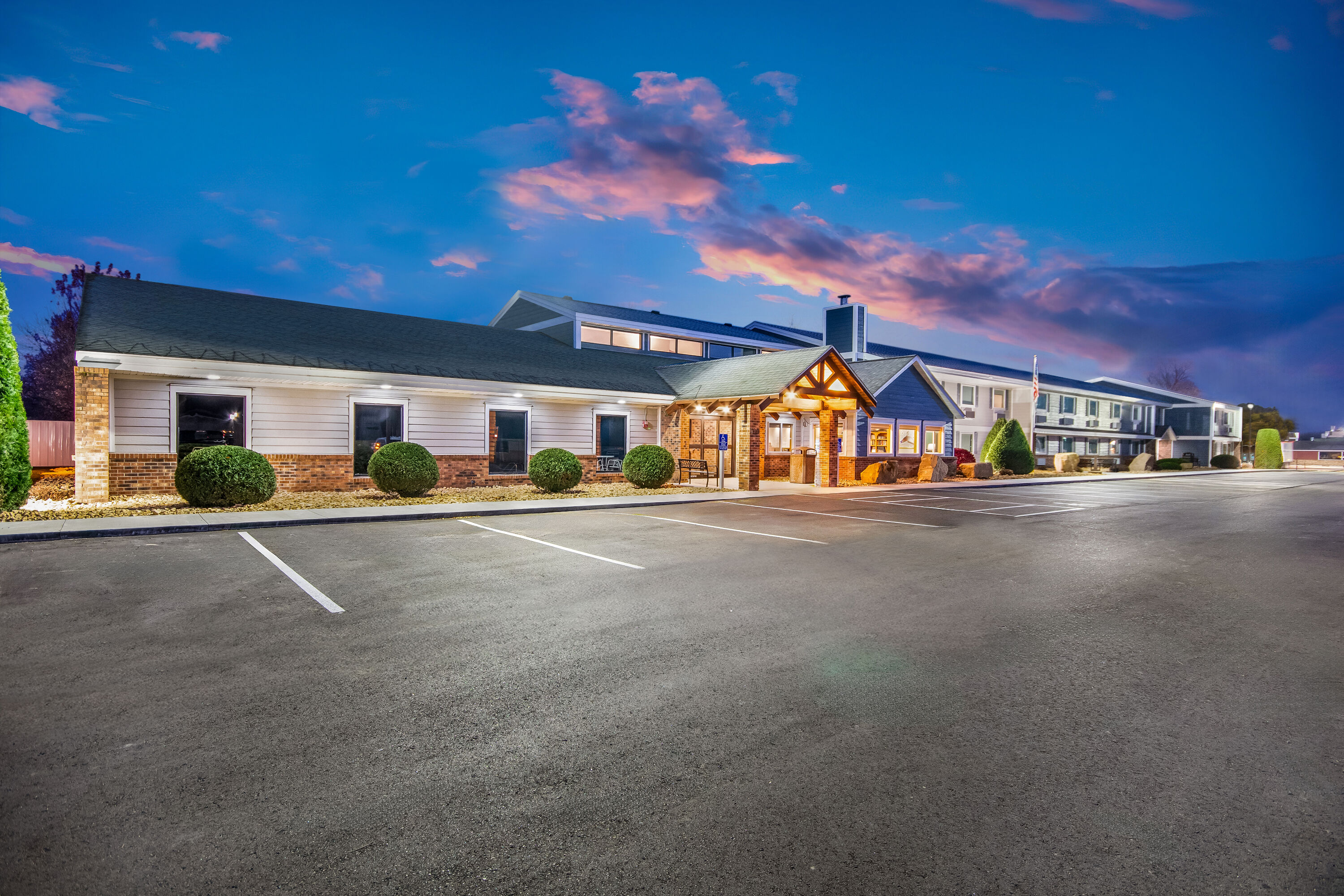 Exterior Dusk Image of AmericInn by Wyndham St. Peter hotel in Saint Peter, Minnesota