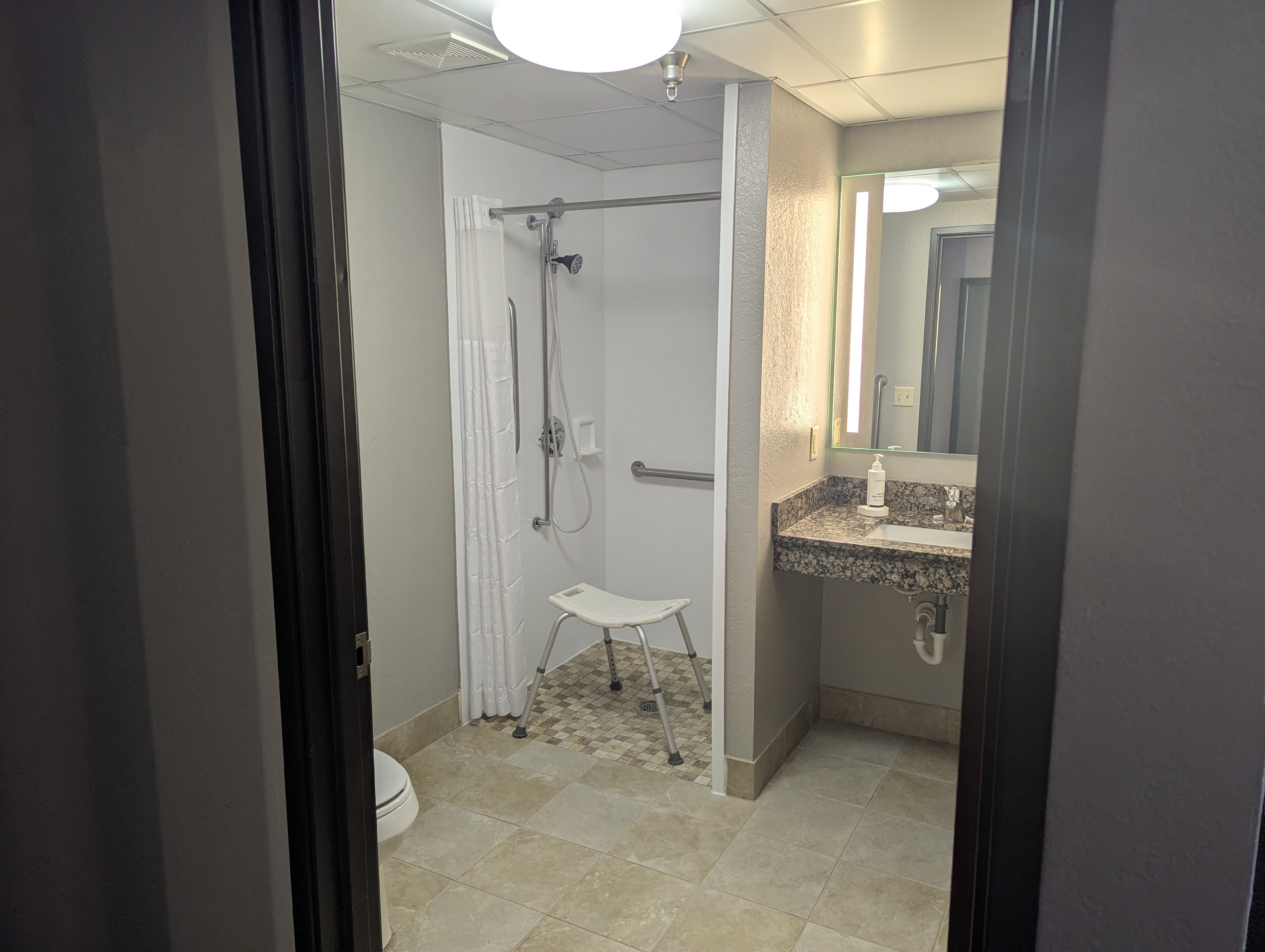 Guest room bath at the AmericInn by Wyndham St. Peter in Saint Peter, Minnesota