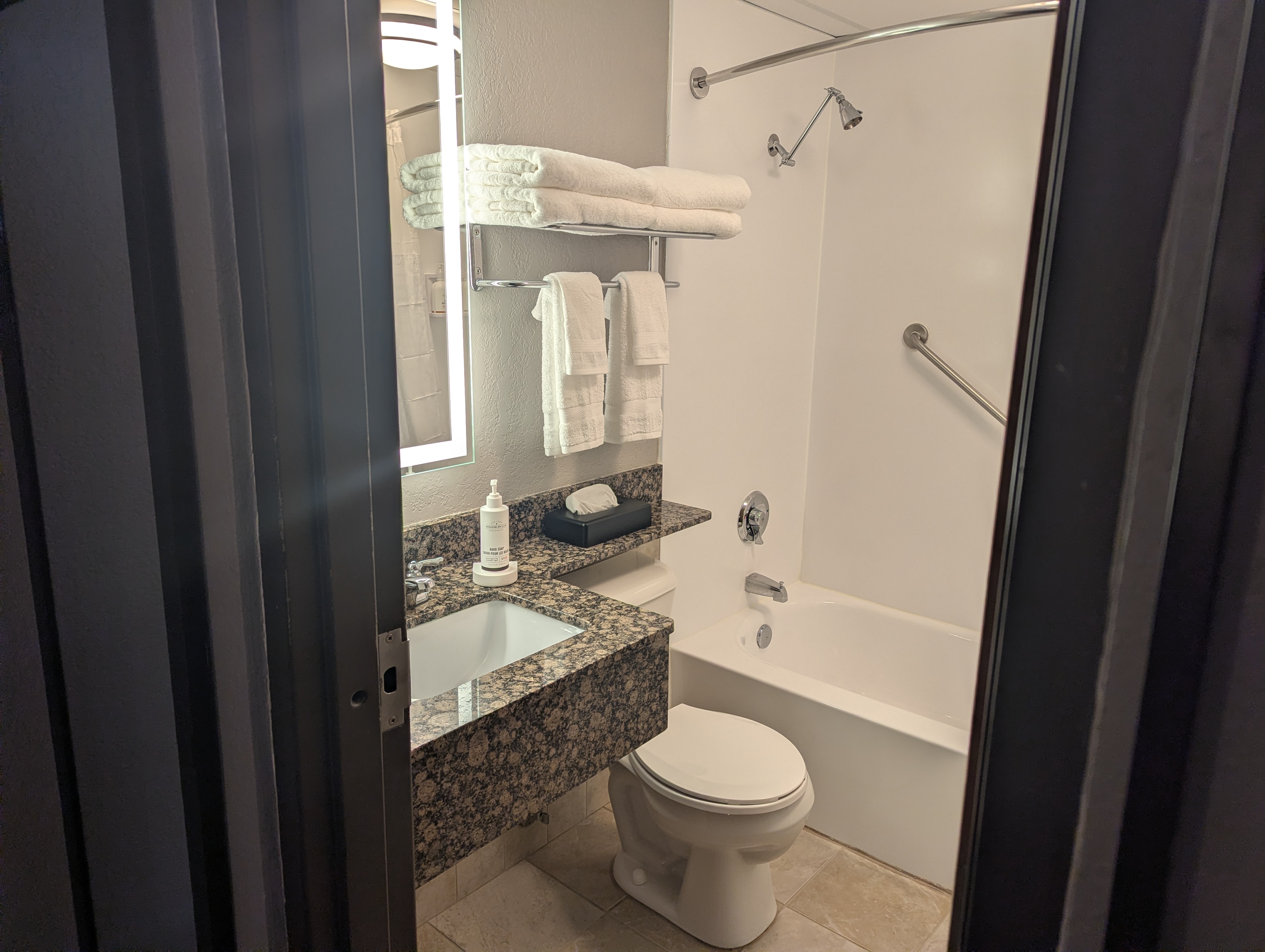 Guest room bath at the AmericInn by Wyndham St. Peter in Saint Peter, Minnesota